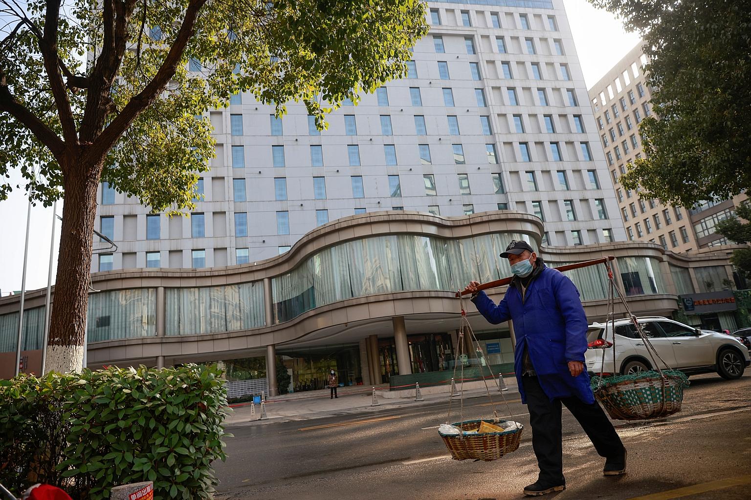 The hotel in Wuhan where the World Health Organisation-led team probing the origins of Covid-19 is in quarantine. The team's arrival at the city on Thursday was disrupted by the absence of two members who failed Covid-19 antibody tests while in trans