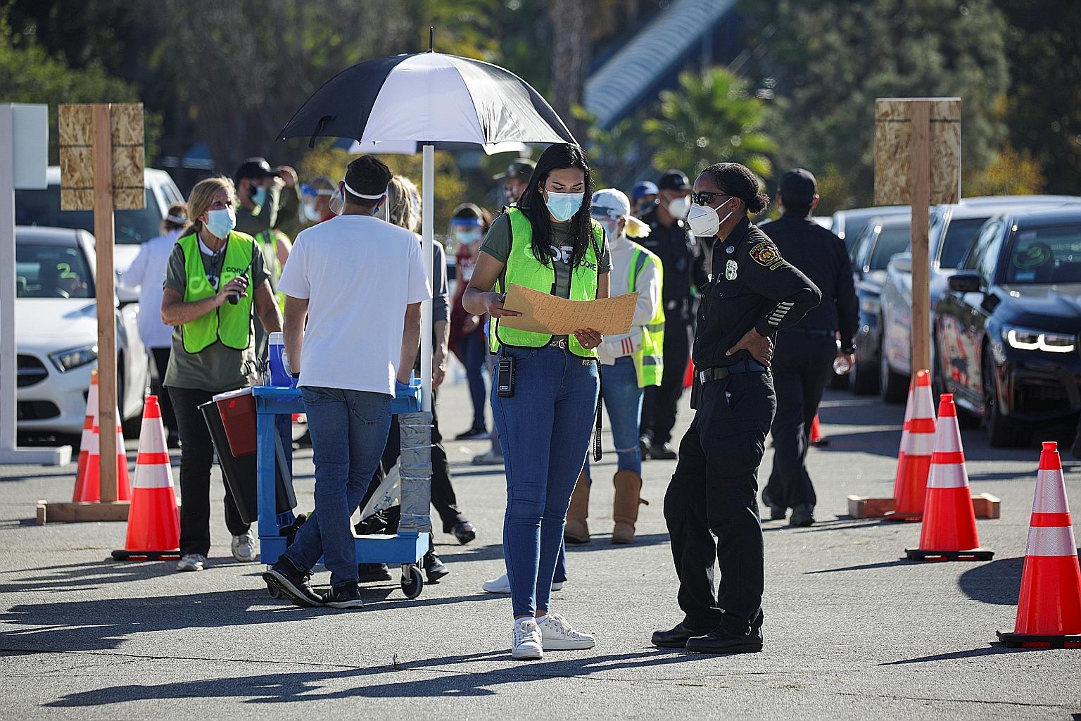 A mass vaccination of healthcare workers taking place at Dodger Stadium in Los Angeles on Friday. The US is in a race to vaccinate as many Americans as possible before the new B.1.1.7 variant spreads across the country.