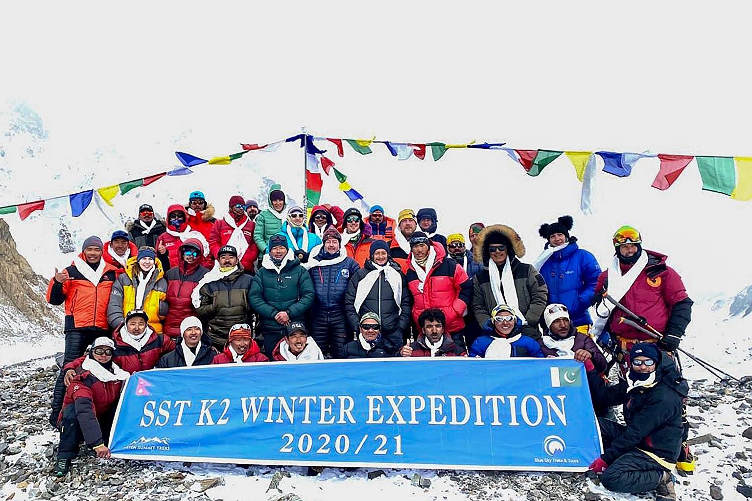 Mountaineers and Sherpas at base camp after a group of 10 Nepali climbers became the first to reach the summit of Pakistan's K2 in wintertime on Saturday. K2 is the second-highest mountain in the world - at 8,611m - and is dubbed "Savage Mountain" fo