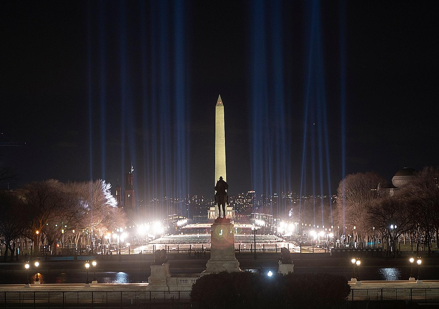 The Washington Monument framed by spotlights on the National Mall on Saturday as preparations were under way ahead of President-elect Joe Biden's inauguration ceremony this Wednesday in Washington. Thousands of National Guard troops have been deploye