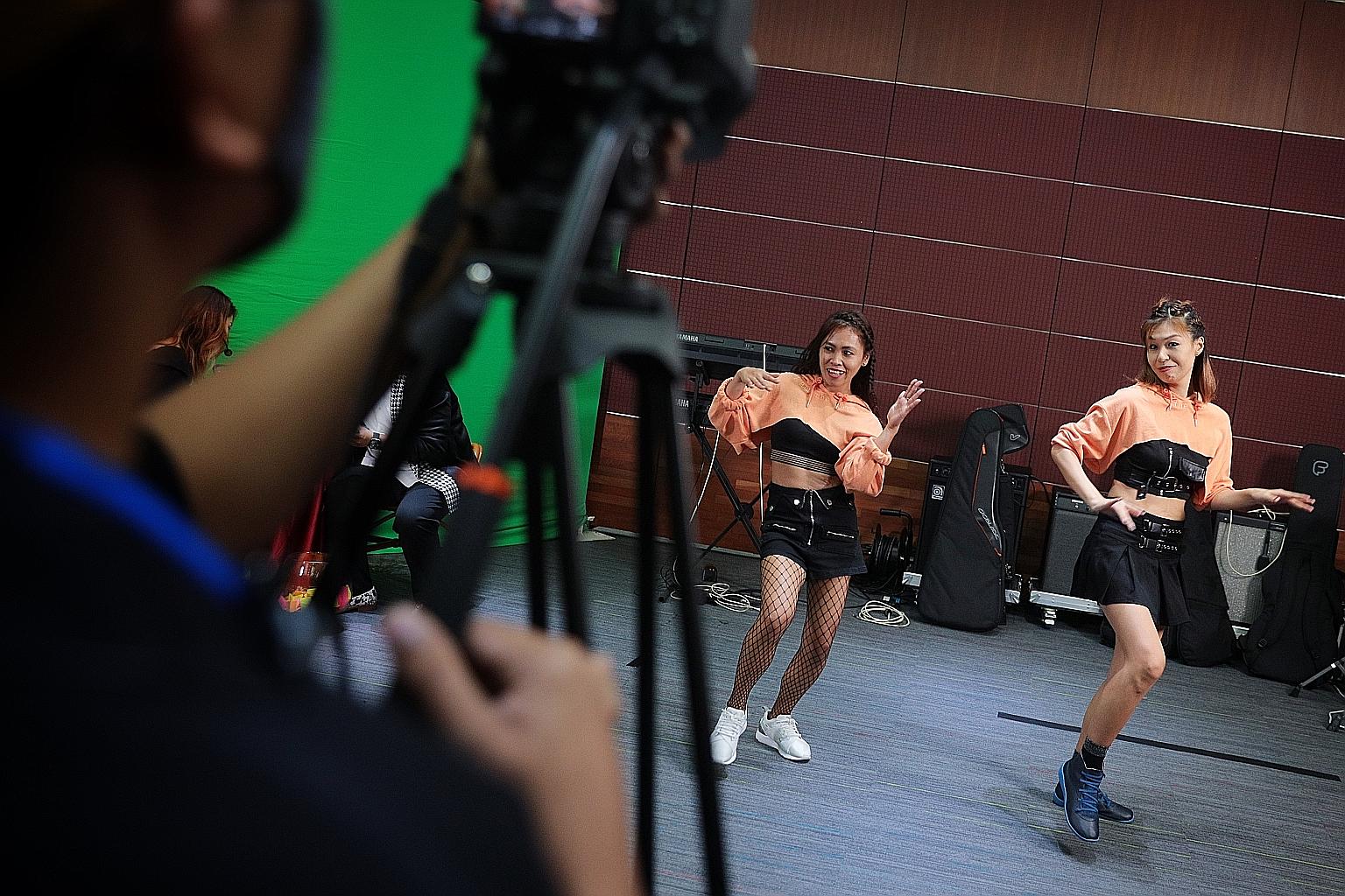 Foreign domestic worker Mary Jane (far left) and her employer Jez Lim performing in a virtual concert organised by the Foreign Domestic Worker Association for Social Support and Training on Sunday. The three-hour show featured song and dance performa