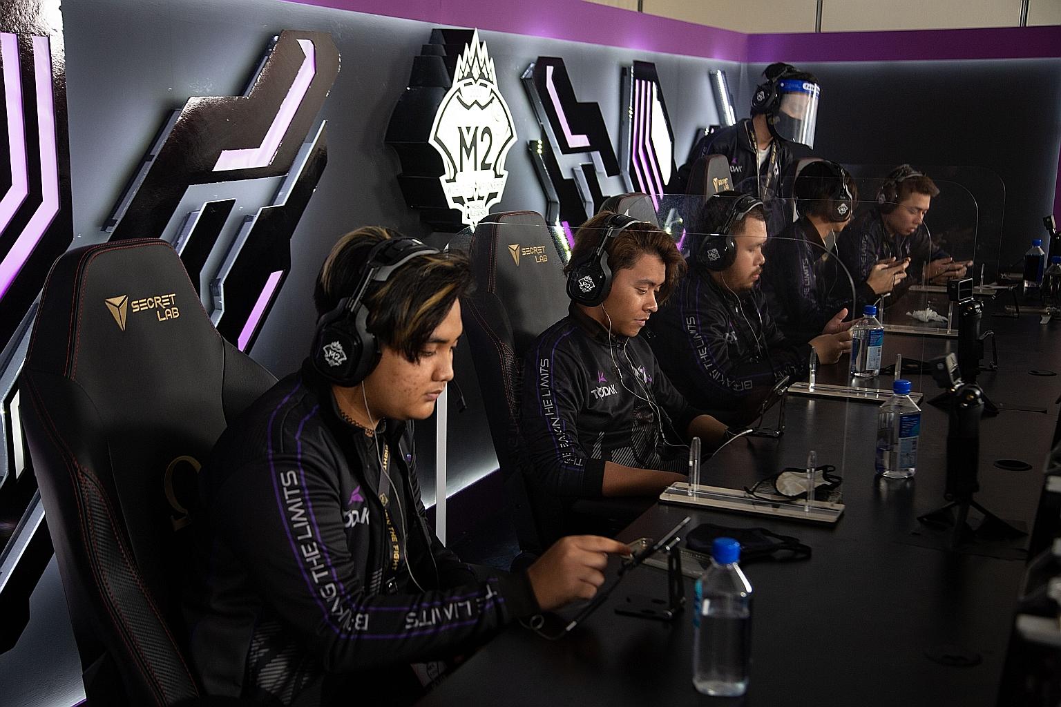 Malaysian team Todak on the opening day of the M2 World Championship at Shangri-La Hotel. The table shields in between the players were part of Covid-19 protocols for the week-long tournament.