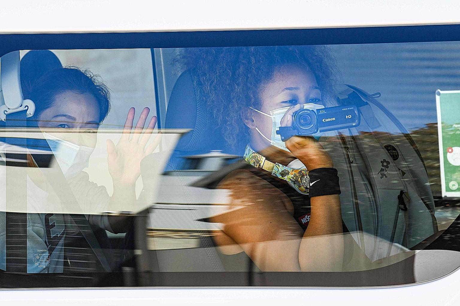 Above: Women's tennis world No. 3 Naomi Osaka uses a video camera as she returns to her hotel after a practice session in Adelaide. Left: Swiss world No. 12 Belinda Bencic doing an improvised tennis workout in her hotel room in Melbourne.