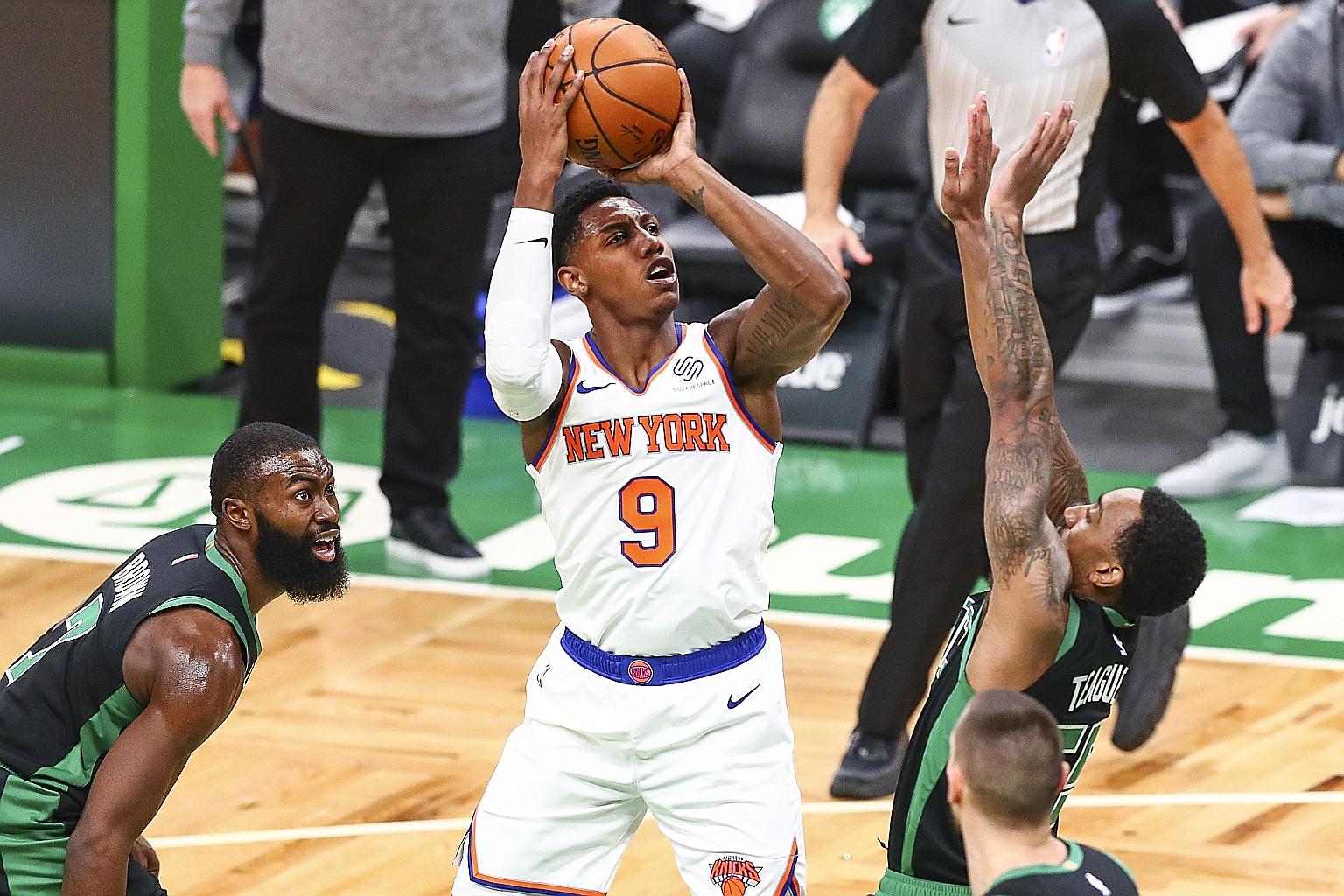 New York's R.J. Barrett shooting over Boston's Jeff Teague in their 105-75 rout on Sunday. The Canadian ended with 19 points.