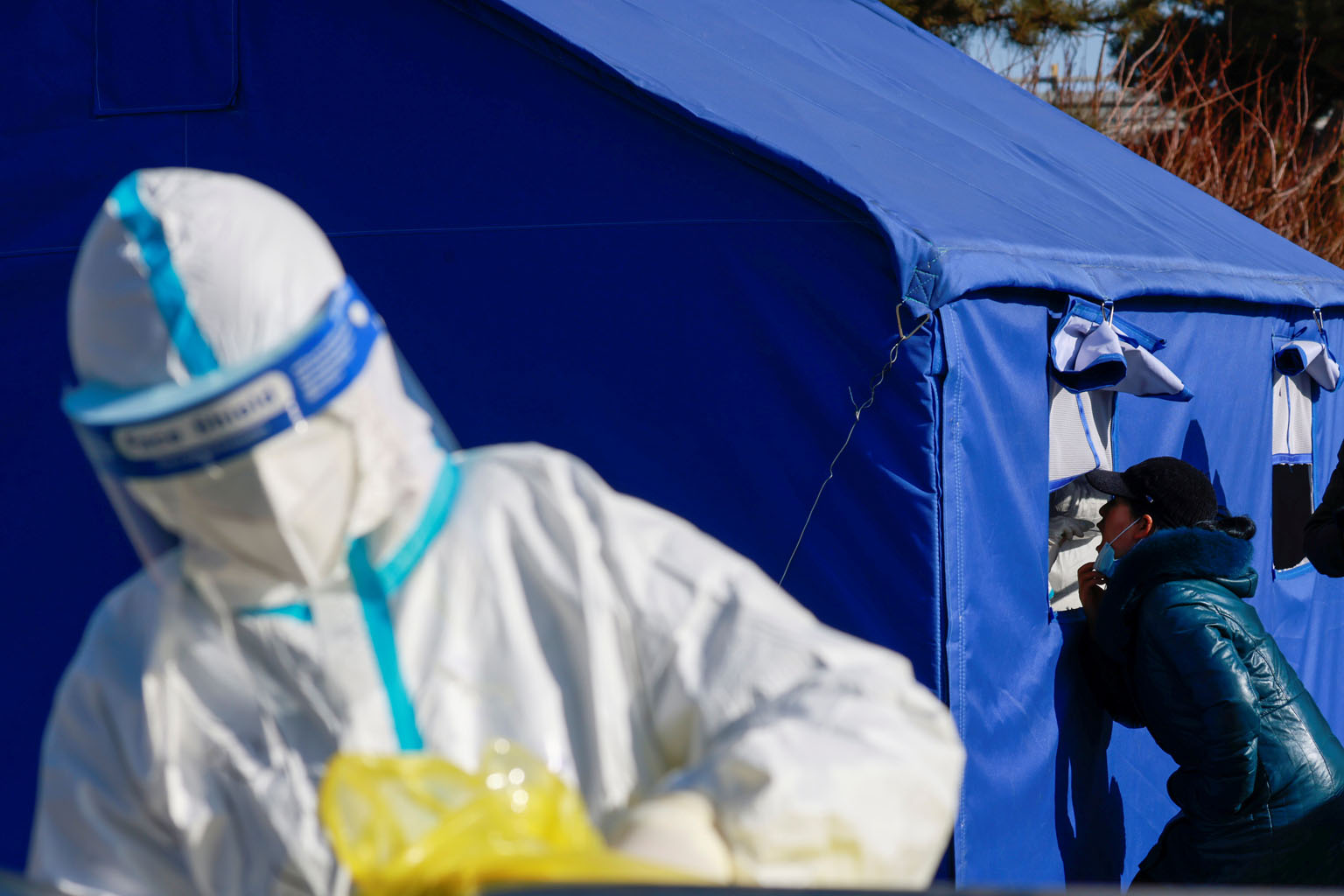 A woman getting tested for Covid-19 at a nucleic acid testing site in Beijing yesterday. PHOTO: REUTERS
