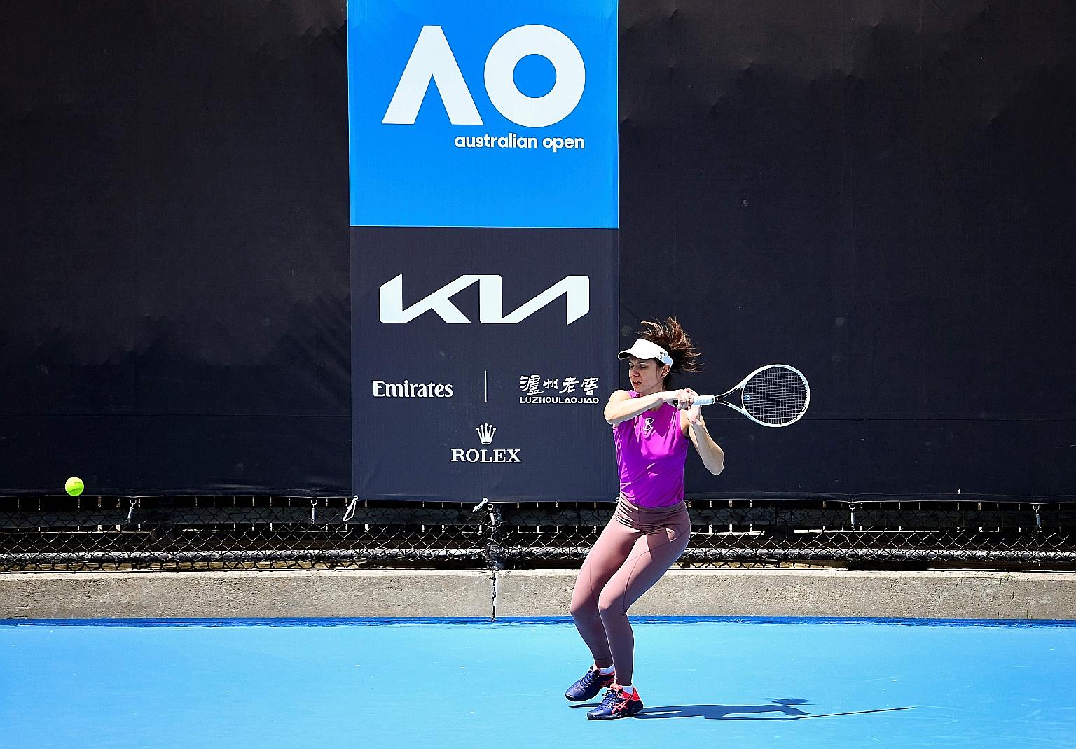 Romania's Ioana Raluca Olaru training ahead of the Australian Open yesterday. While she is able to practise on the court, 72 players are confined to their hotel rooms, where some have resorted to hitting balls against the wall.