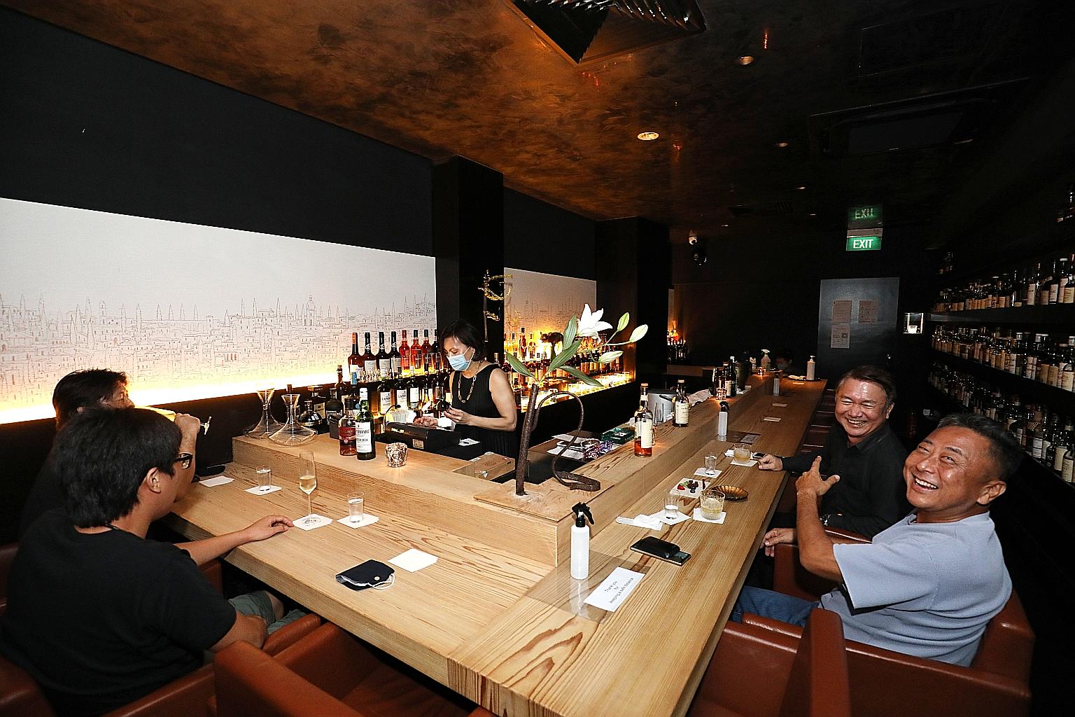 Bar Kiharu at Orchard Plaza (above), Bell Bar at Cuppage Plaza and Skinny's Lounge at Boat Quay were part of an earlier reopening pilot for bars and pubs. They will be allowed to continue to operate for now.