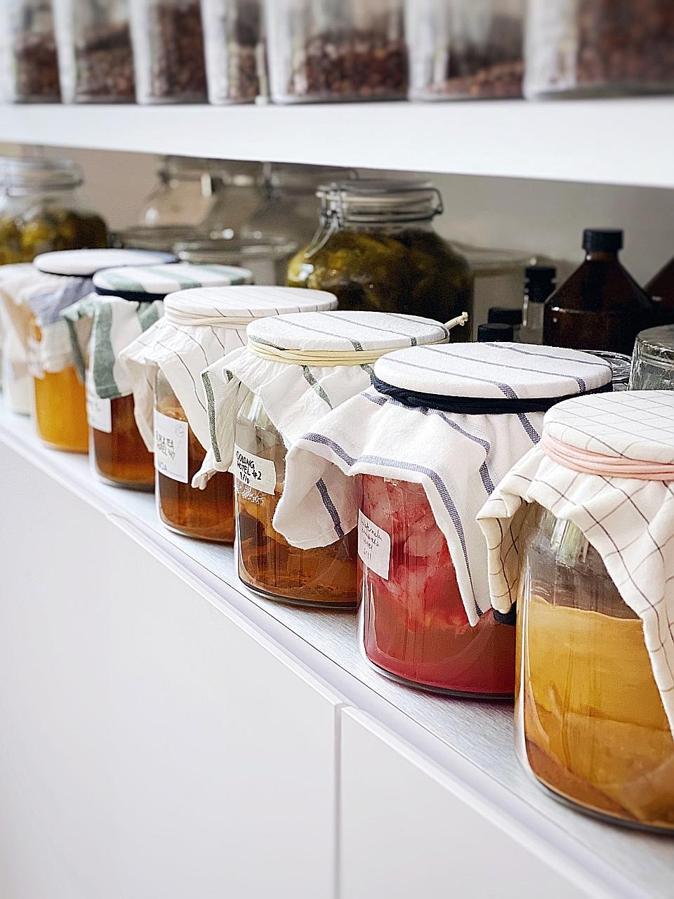 Kombucha (above) is made by fermenting tea and sugar with the kombucha culture, scoby (symbiotic culture of bacteria and yeast).