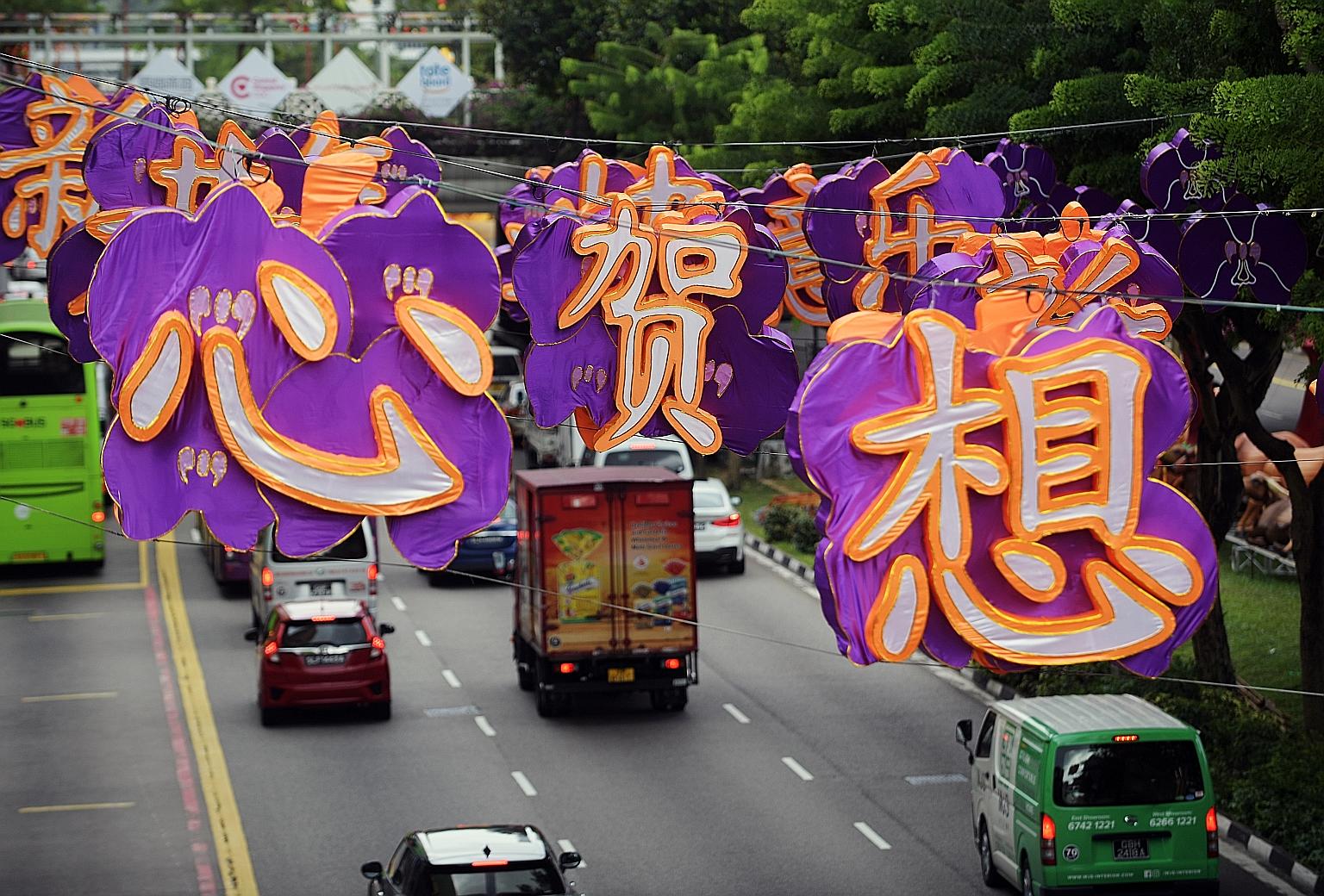 Chinese New Year decorations in Chinatown yesterday. This year's centrepiece will be located opposite Chinatown Point. It will be 10m tall, depicting a golden ox surrounded by gold coins and ingots, with a riverbank and water wheel next to it represe