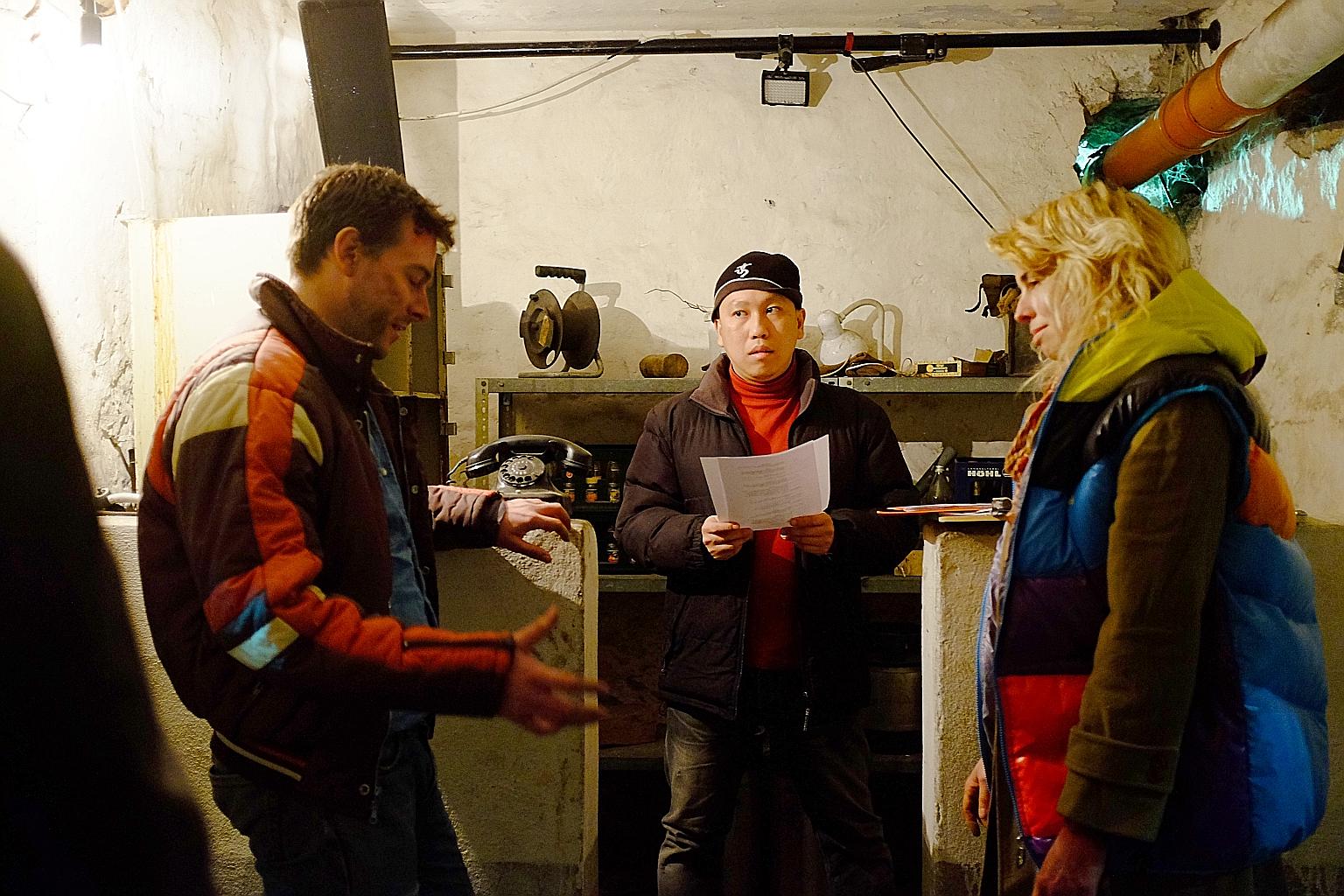 Singapore film-maker Marcus Lim flanked by James Carney and Mari Bensel on the set of The Man On The Other Side.