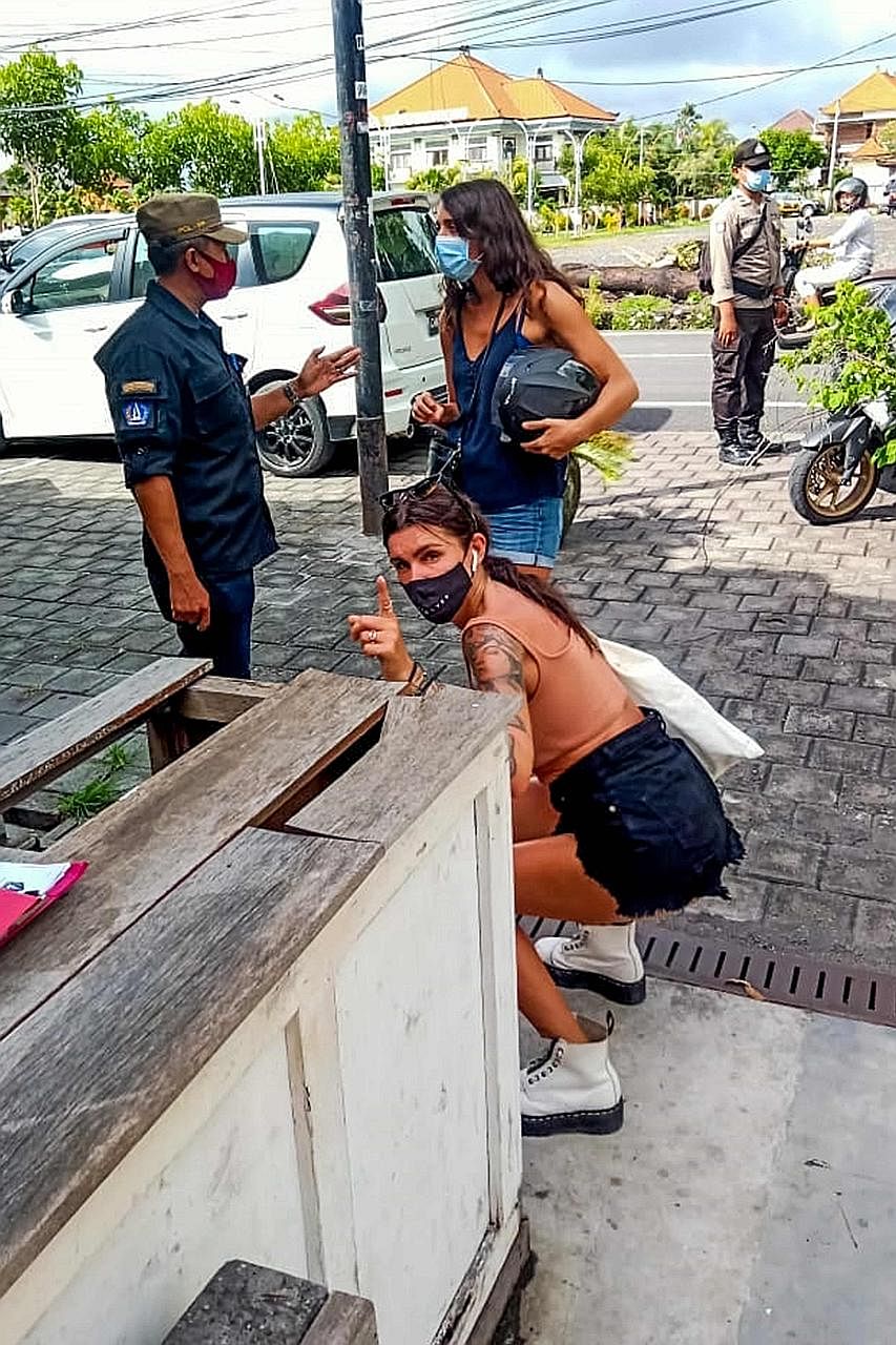 Above: A foreigner in Bali doing squats as punishment for not wearing a face mask or for wearing it improperly. Left: A man doing push-ups for a similar offence. PHOTOS: AGENCE FRANCE-PRESSE