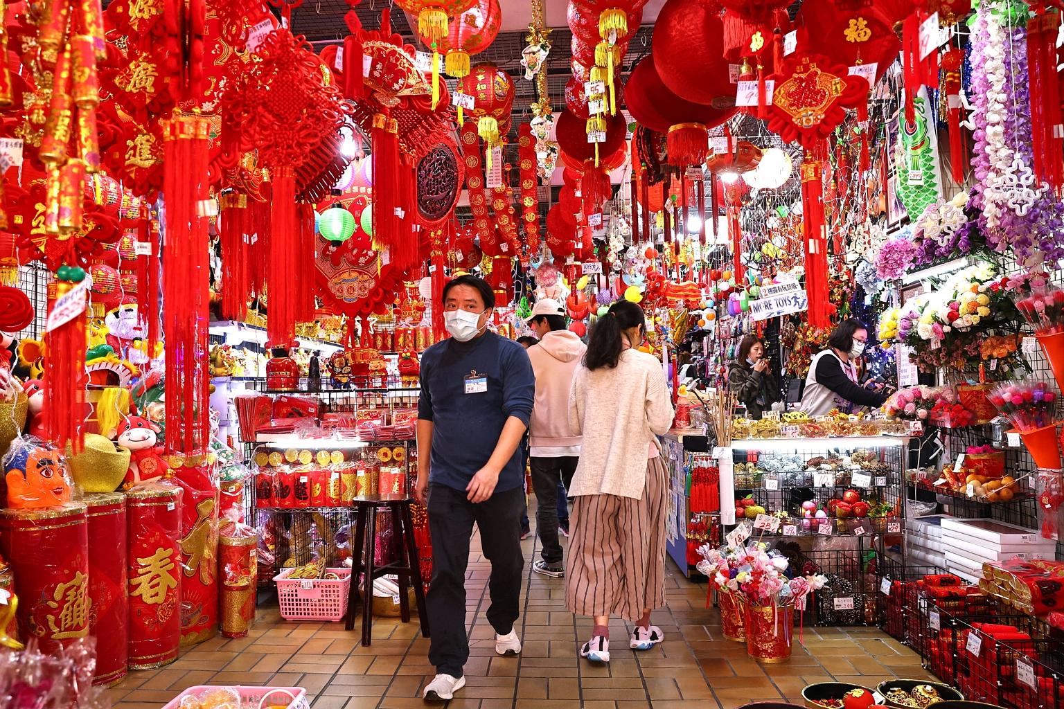People shopping ahead of Chinese New Year in Taipei yesterday. Taiwan has been praised for its pandemic response, but a rare outbreak of Covid-19 infections connected to a hospital last week has caused alarm. PHOTO: REUTERS