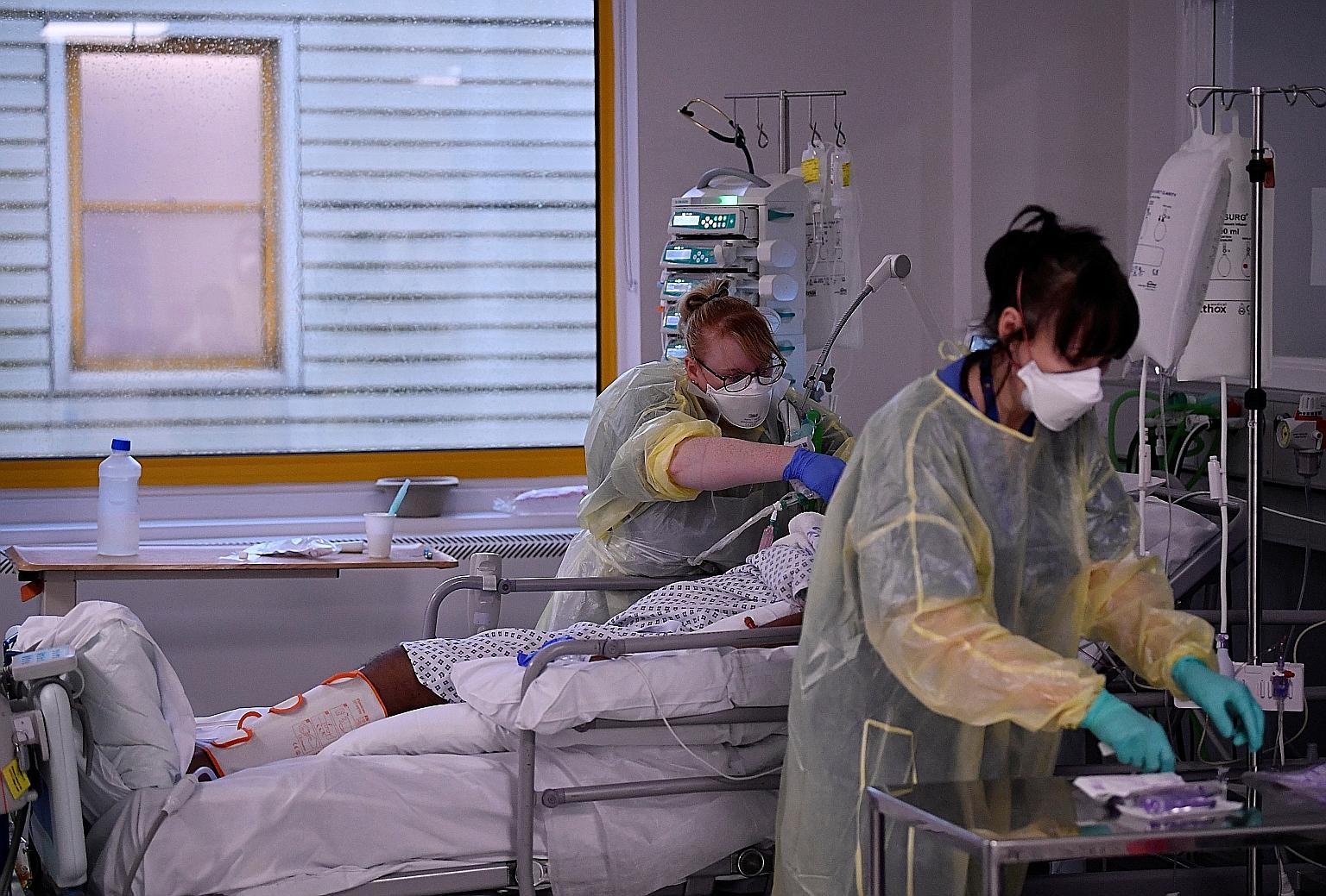 Nurses tending to a Covid-19 patient in the intensive care unit at Milton Keynes University Hospital in England. The hospital said it had seen more than twice the number of patients in the second wave than the first.