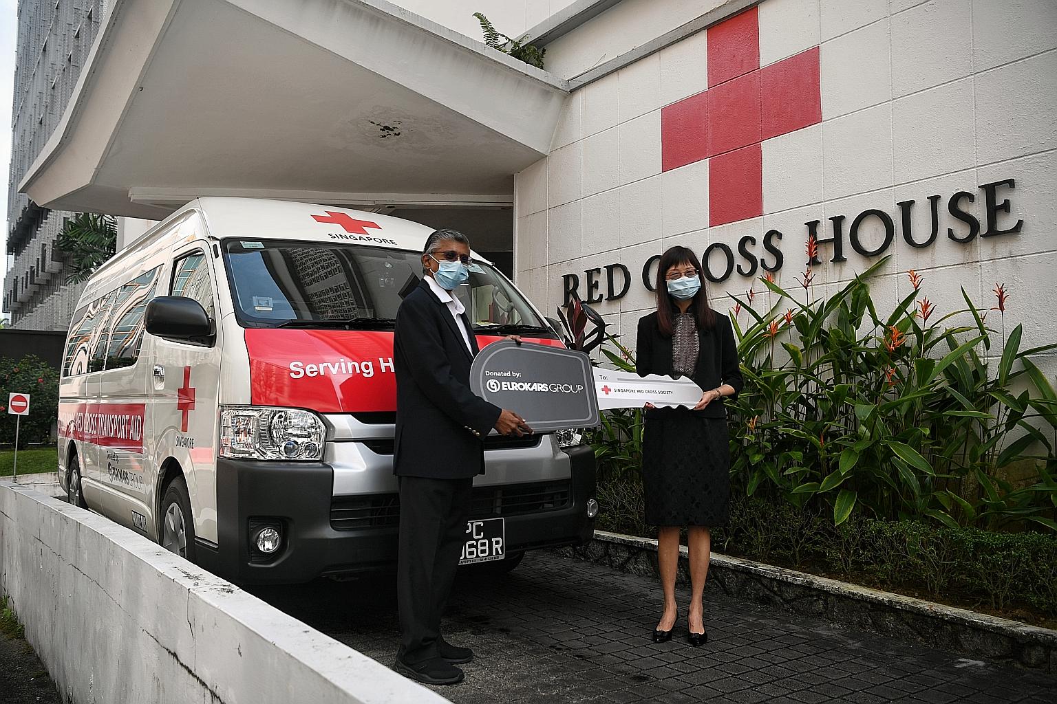 Singapore Red Cross chief executive and general secretary Benjamin William and Eurokars Group managing director Ong Lay Ling at the handover ceremony at Red Cross House on Wednesday.