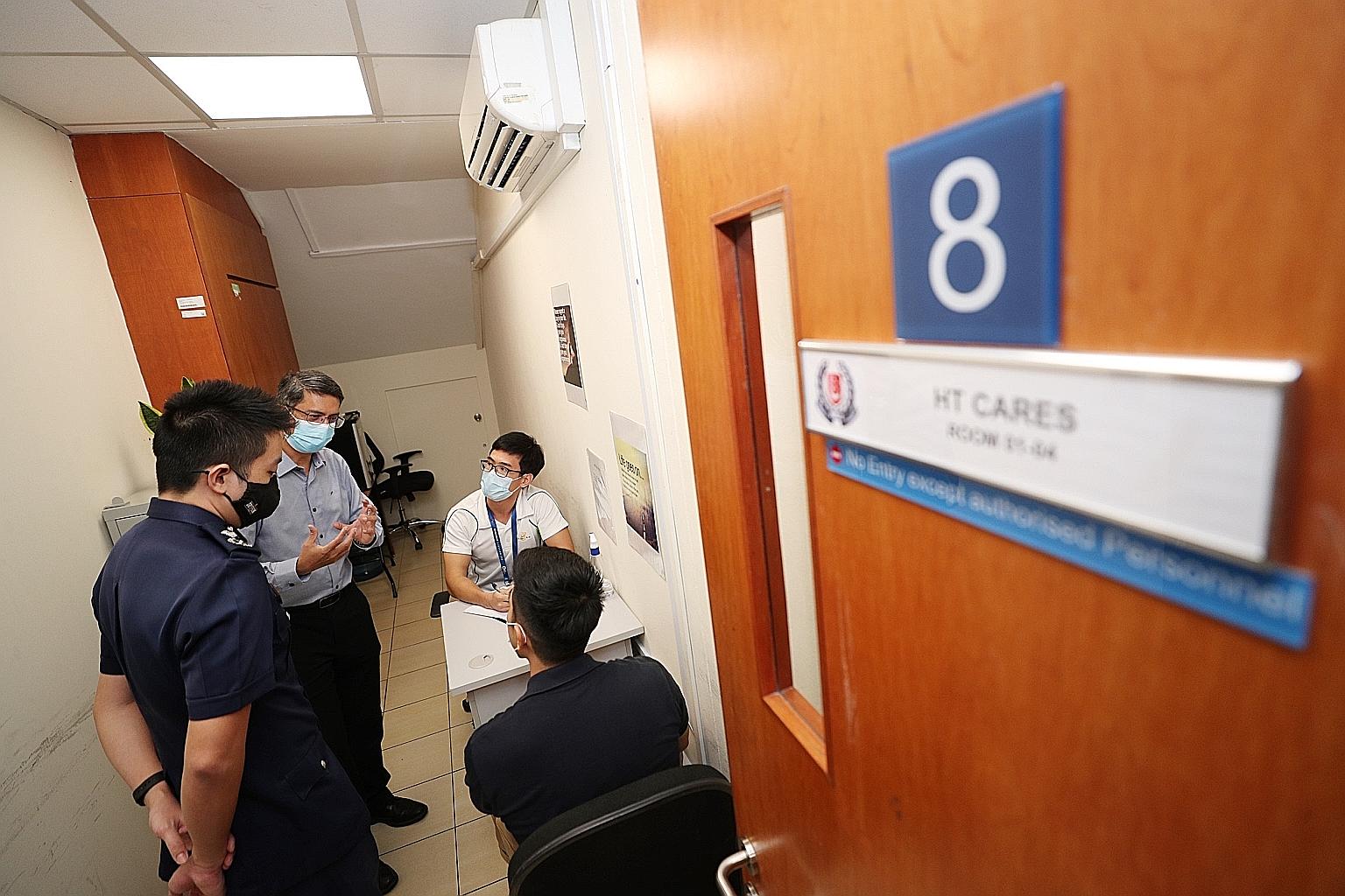 Minister of State for Home Affairs Muhammad Faishal Ibrahim observing a demonstration yesterday of how a social worker from Fei Yue would interview an offender to establish what type of intervention may be needed, and the appropriate social service a