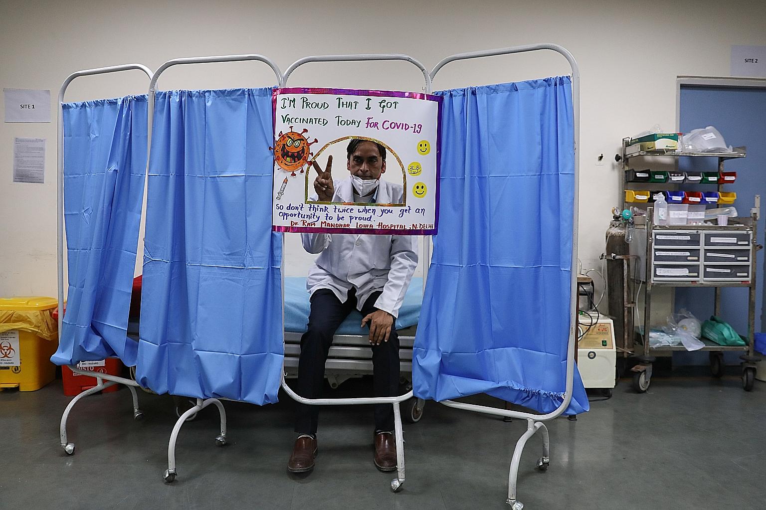 A doctor posing for a photo after receiving a dose of the Covaxin Covid-19 vaccine at a government-run hospital in New Delhi on Tuesday. The vaccine is developed by Indian firm Bharat Biotech.