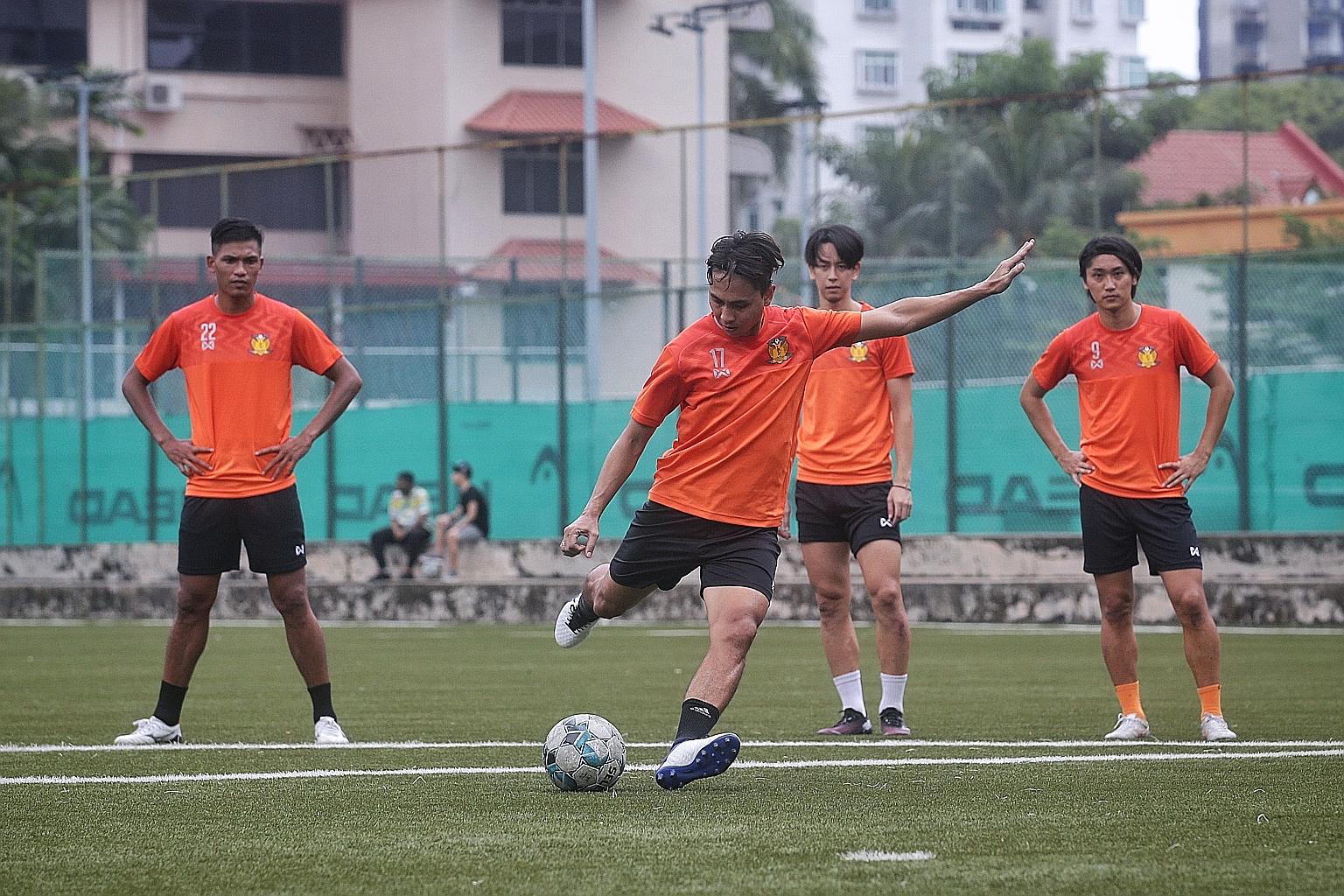 Shahril Ishak shooting at training as fellow new signings (from left) Khairul Nizam, Kaishu Yamazaki and Tomoyuki Doi await their turn at St Wilfrid Field.