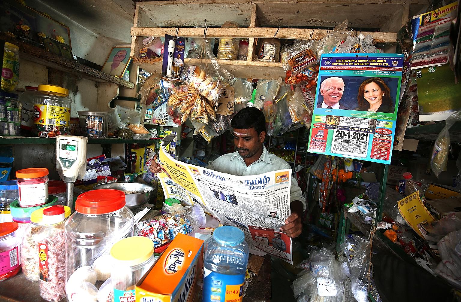 A calendar with the images of US President Joe Biden and Vice-President Kamala Harris in a shop in Thulasendrapuram, a village in the Indian state of Tamil Nadu. Ms Harris' late grandfather P.V. Gopalan was from the village. PHOTO: EPA-EFE