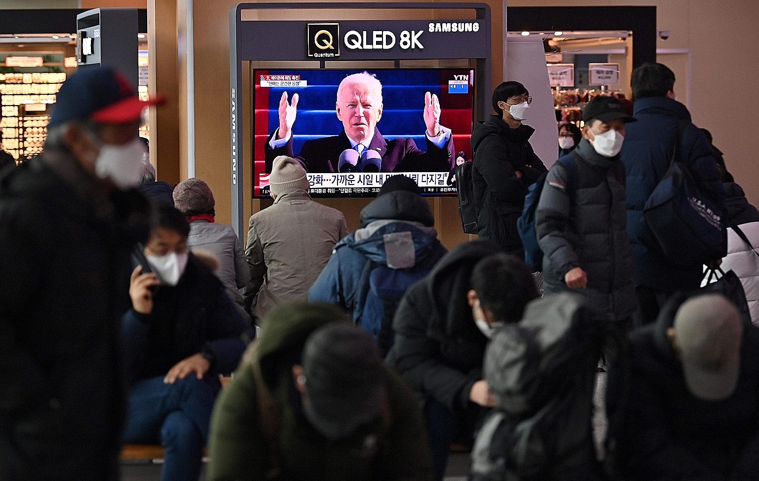 A television news programme in Seoul on Thursday on the inauguration of US President Joe Biden. South Korean President Moon Jae-in was effusive in his congratulatory message to Mr Biden.
