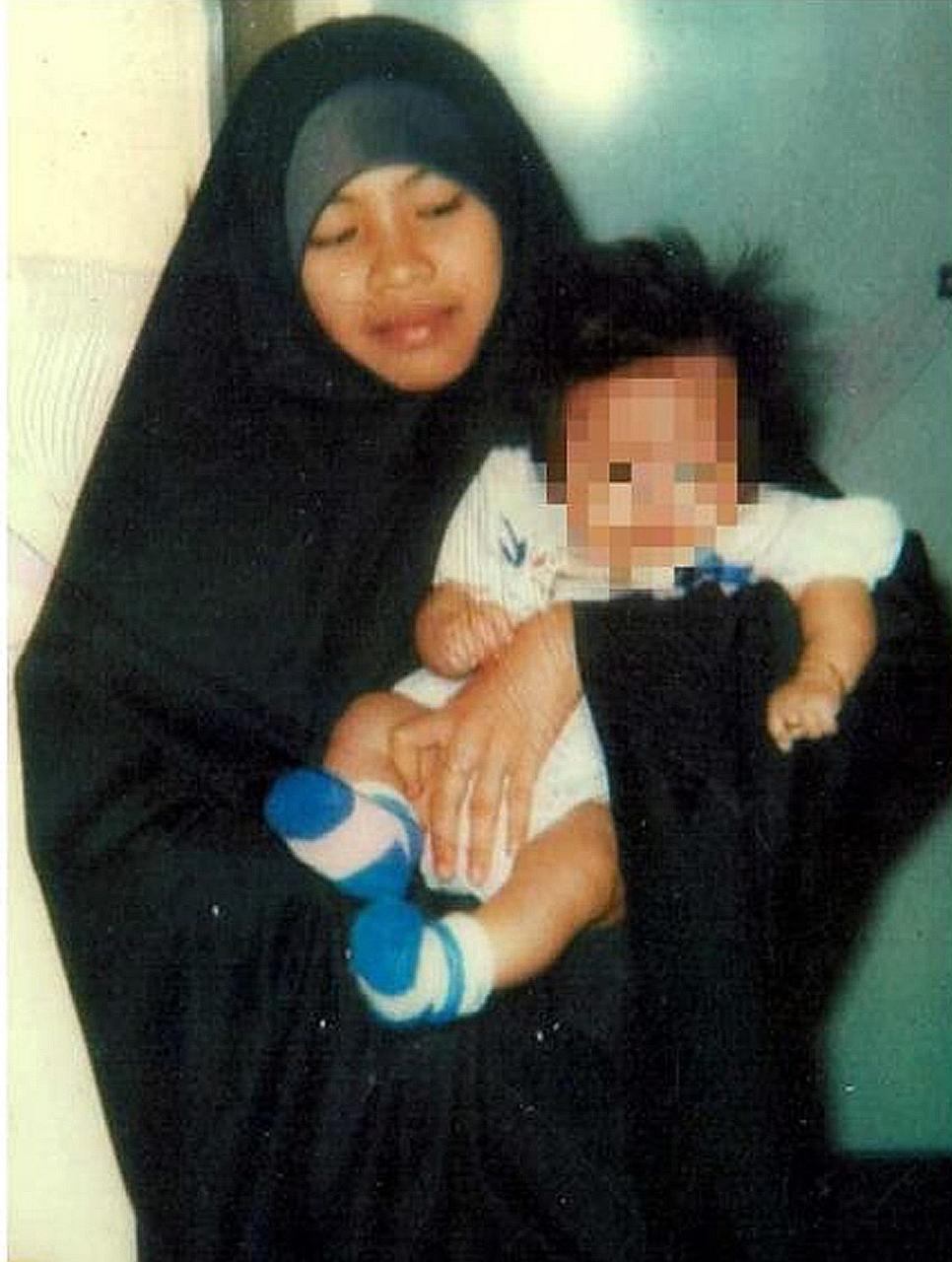 Noraliza Abdullah @ Lee Yin Len (above), the wife of terrorist Riduan Isamuddin (left), also known as Hambali, was detained by police under the Internal Security Act after her husband's capture in 2003. Regional intelligence sources say Noraliza, who