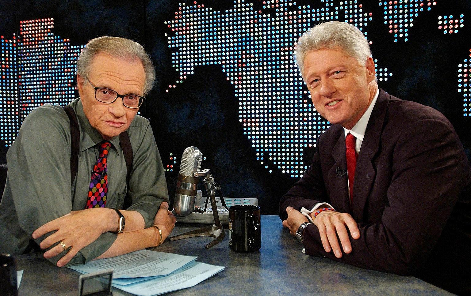 Broadcast interviewer Larry King (left) with former US president Bill Clinton on CNN talk show Larry King Live, in New York in 2002. Mr King interviewed every sitting US president from Mr Gerald Ford to Mr Barack Obama.