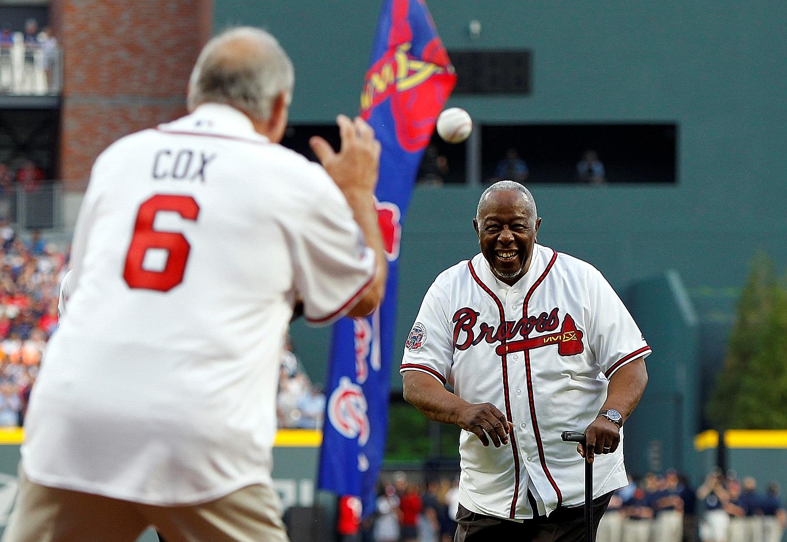 Major League Baseball Hall of Famer Hank Aaron throwing the ceremonial first pitch in 2017. He held the career home-run record of 755 for 33 years until Barry Bonds broke it in 2007.