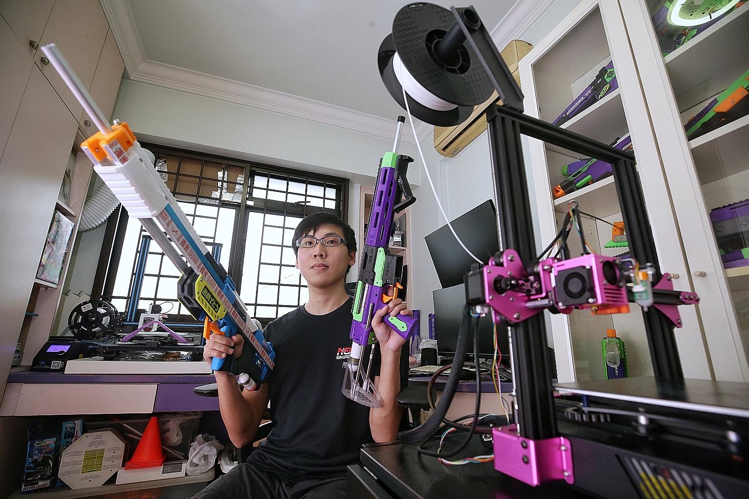 Nerf enthusiast Sim Jia Jun with two of his 3D-printed Nerf guns. He said the 200-strong Nerf community in Singapore was glad such blasters would not be regulated under the new law, which makes the unauthorised possession of digital blueprints of gun