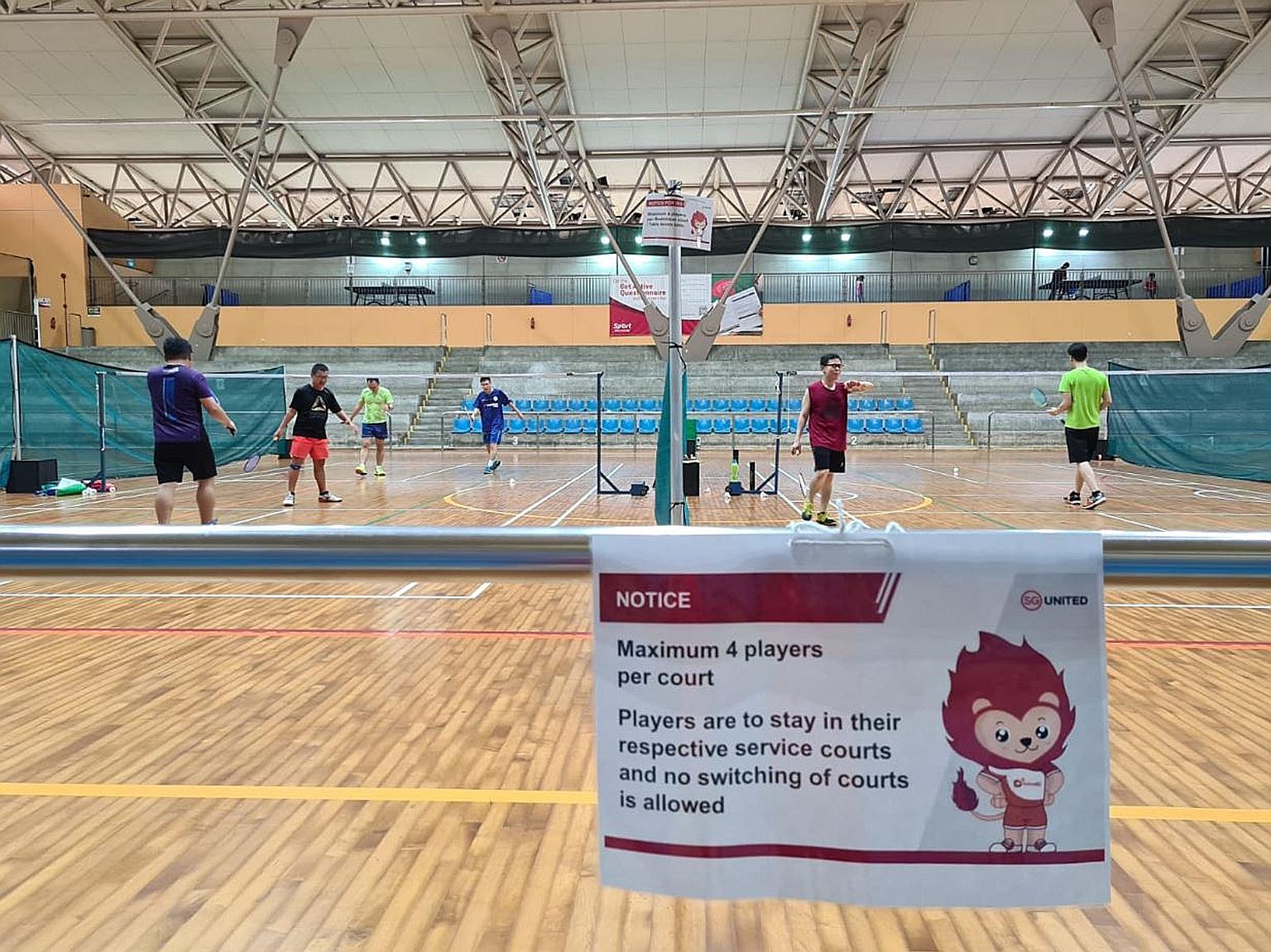 Recreational shuttlers playing badminton at Yishun Sports Hall. Many players have resorted to getting court time via third parties due to overwhelming demand.