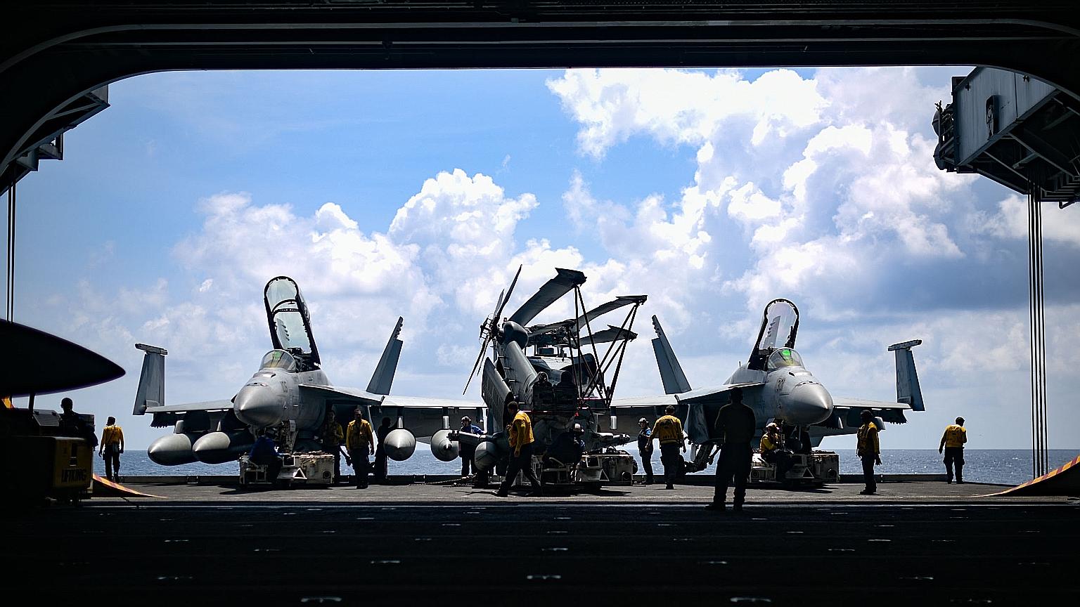 A 2018 photo showing fighter jets on board the USS Theodore Roosevelt. An aircraft carrier group led by the USS Theodore Roosevelt has entered the South China Sea to promote "freedom of the seas".