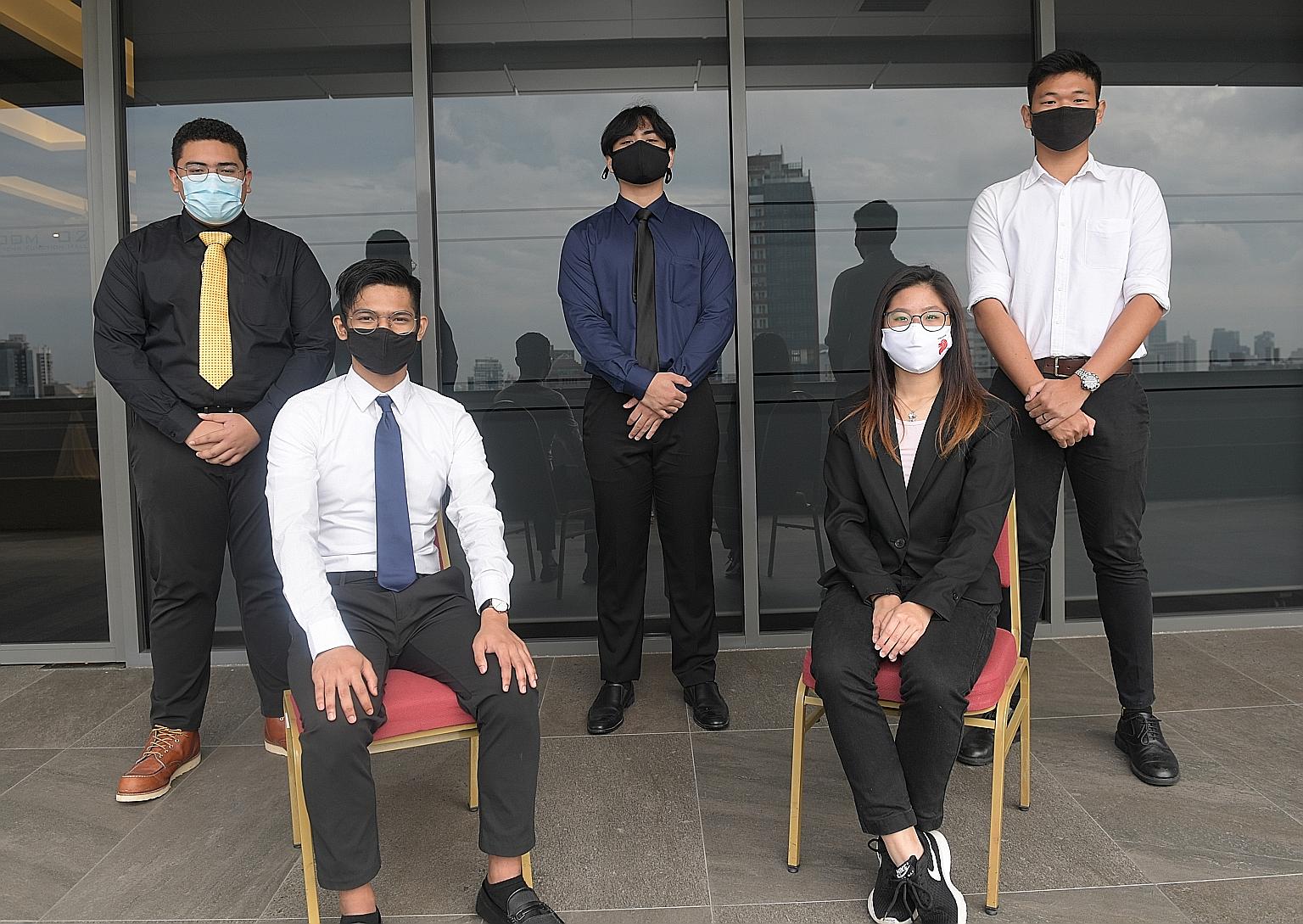 The recipients of the National Environment Agency-Industry Scholarship at a ceremony on Saturday were (from left) Mr Abdul Qahar Zaini, Mr Daeng Budi Iskandar Jumahat, Mr Muhammad Anaqi Harjuna, Ms Enrica Ng and Mr Cyrus Ng Boon Bing. Fellow recipien