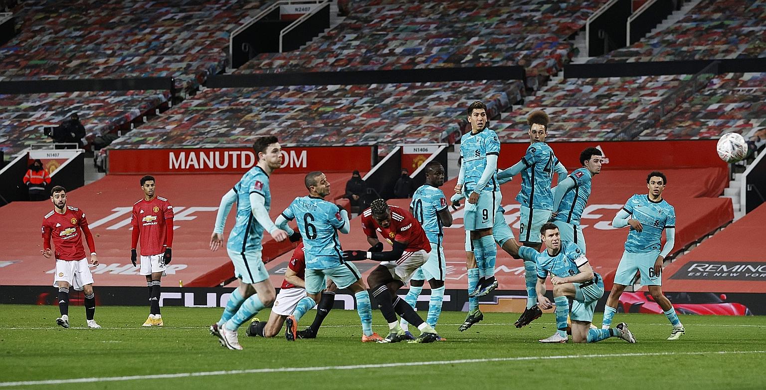 Manchester United's Bruno Fernandes (far left) scoring their winner against Liverpool in the FA Cup fourth round from a free kick. They have lost only once in all competitions since exiting the Champions League last month.
