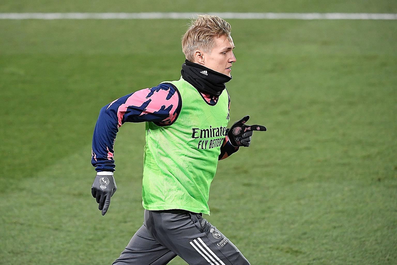 Martin Odegaard warming up before the La Liga game against Celta this month. He has had limited opportunities at Real Madrid.