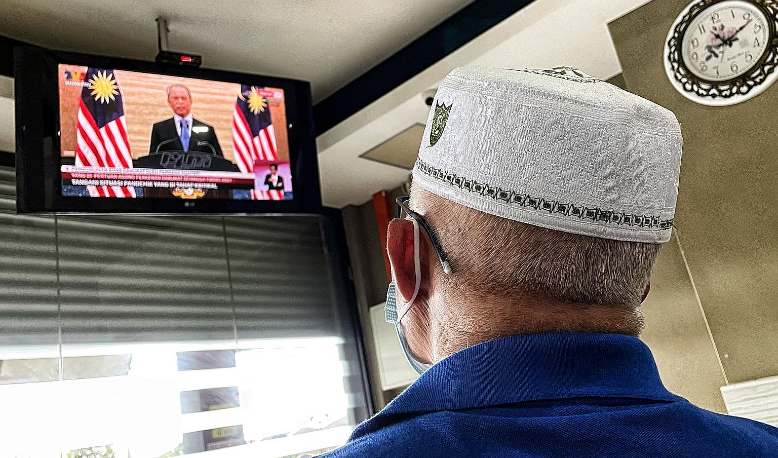 Prime Minister Muhyiddin Yassin seen on television during a special national address on Jan 12, when Malaysia declared a state of emergency to battle the Covid-19 pandemic. Opposition leader Anwar Ibrahim described the emergency declaration as an "eg