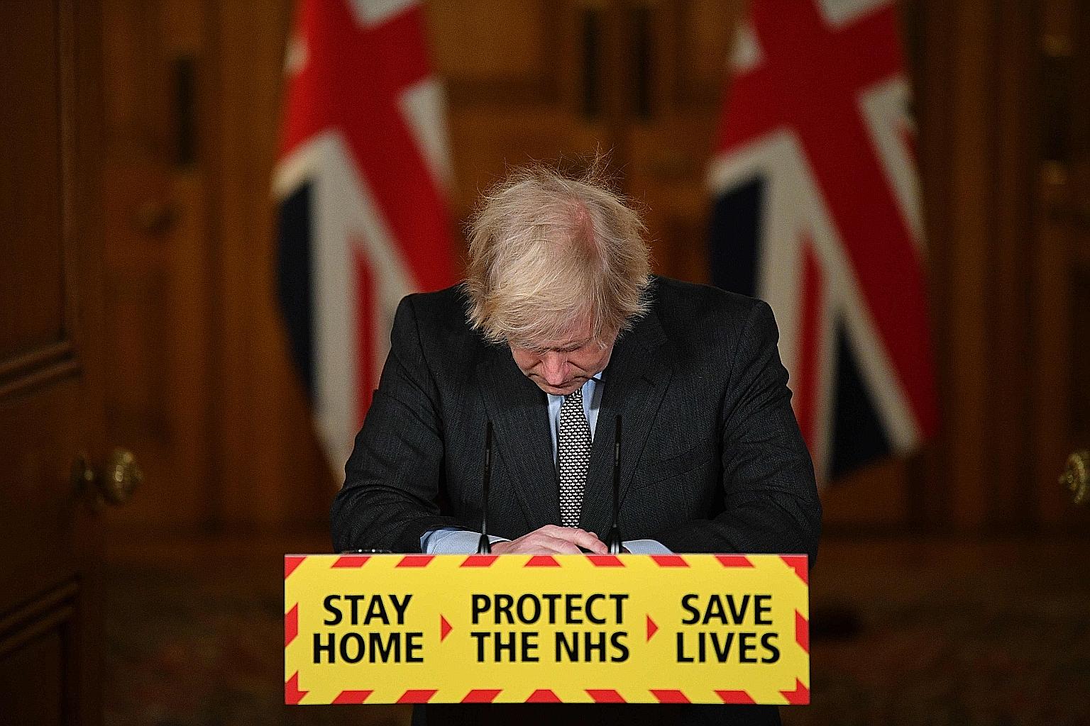 British Prime Minister Boris Johnson at a virtual press conference in London on Tuesday. Mr Johnson said that it was "hard to compute" the loss felt by families across the country. Britain's death toll has long been the worst in Europe, but a fast-sp