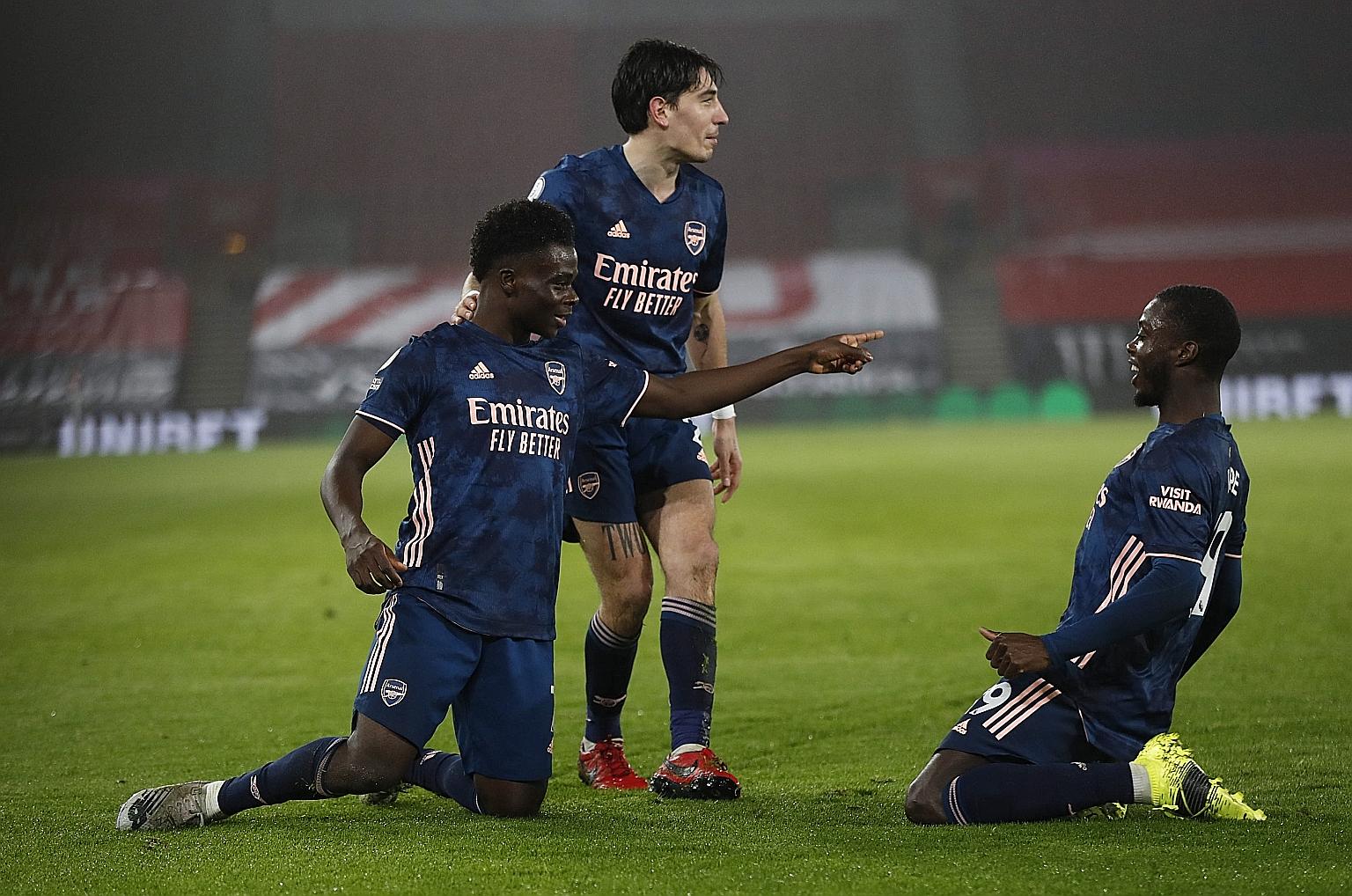 Bukayo Saka (far left) celebrating with his teammates after his goal put Arsenal 2-1 ahead against Southampton in the Premier League on Tuesday. The teenager has five league goals this season. Alexandre Lacazette is the only Gunner with more (eight).