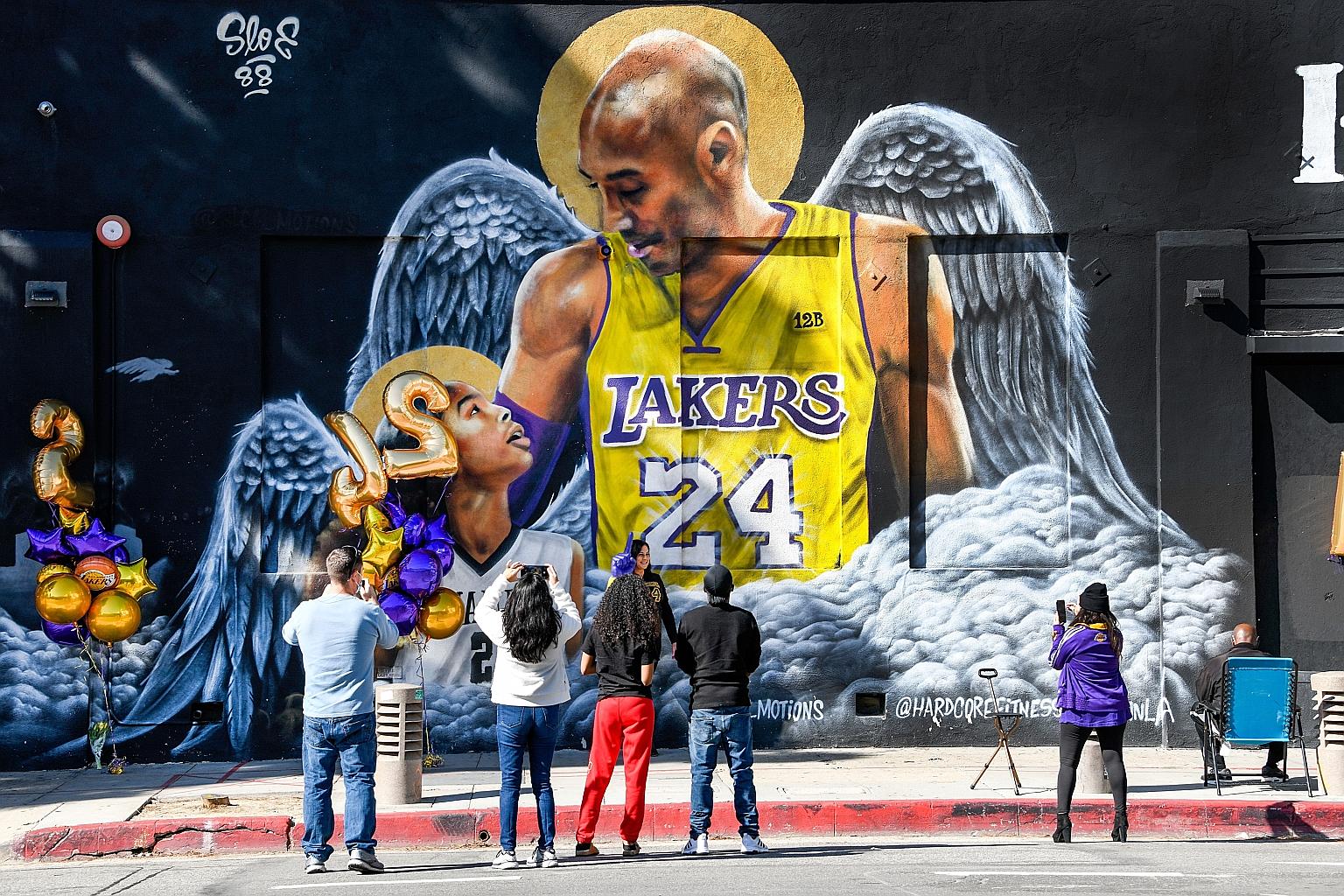 Fans gathering at a mural of Kobe Bryant and his daughter Gianna in downtown Los Angeles. Lakers legend Bryant was 41 and his daughter 13 when they and seven other persons died in a helicopter crash in Calabasas, California, on Jan 26 last year.