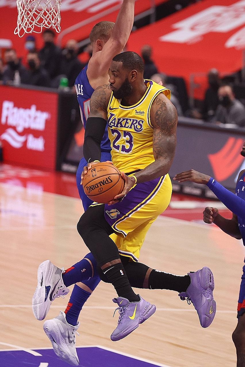 Lakers superstar LeBron James driving to the basket against the Pistons' Mason Plumlee on Thursday in Detroit, Michigan. The NBA champions were shocked 107-92 for a second straight road loss.
