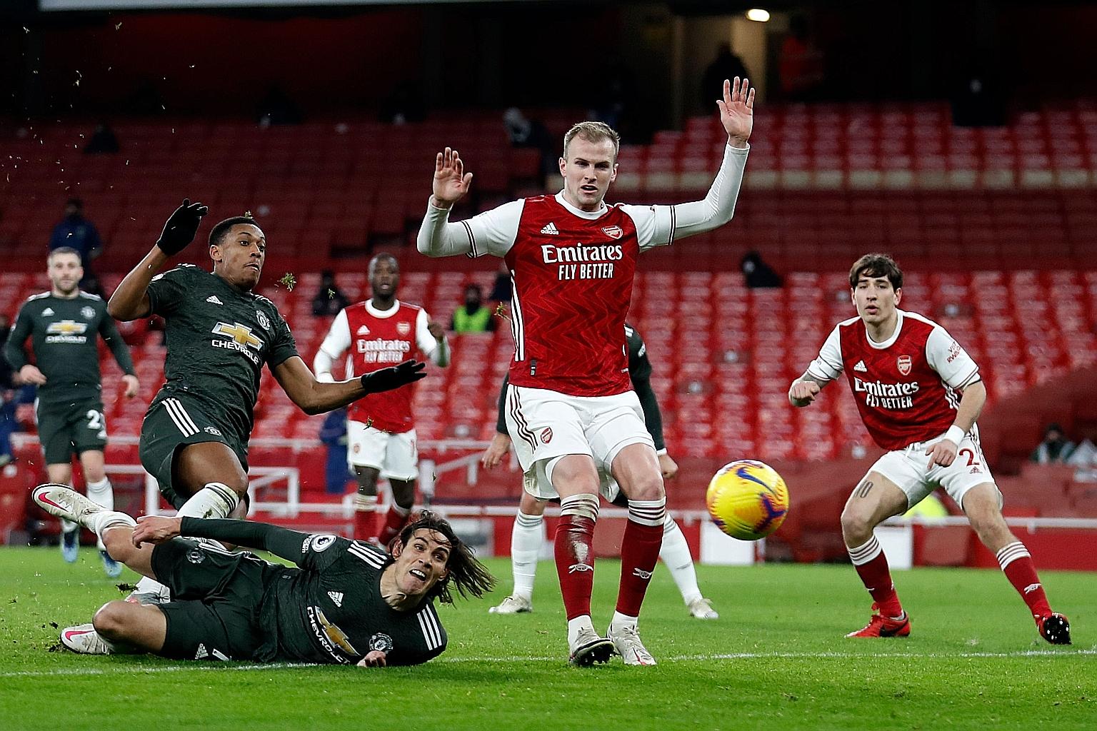 Manchester United striker Edinson Cavani (on the ground) watching his shot go wide in the league stalemate against an under-strength Arsenal at the Emirates Stadium on Saturday. The Uruguayan's side have yet to beat any of their "Big Six" rivals in t