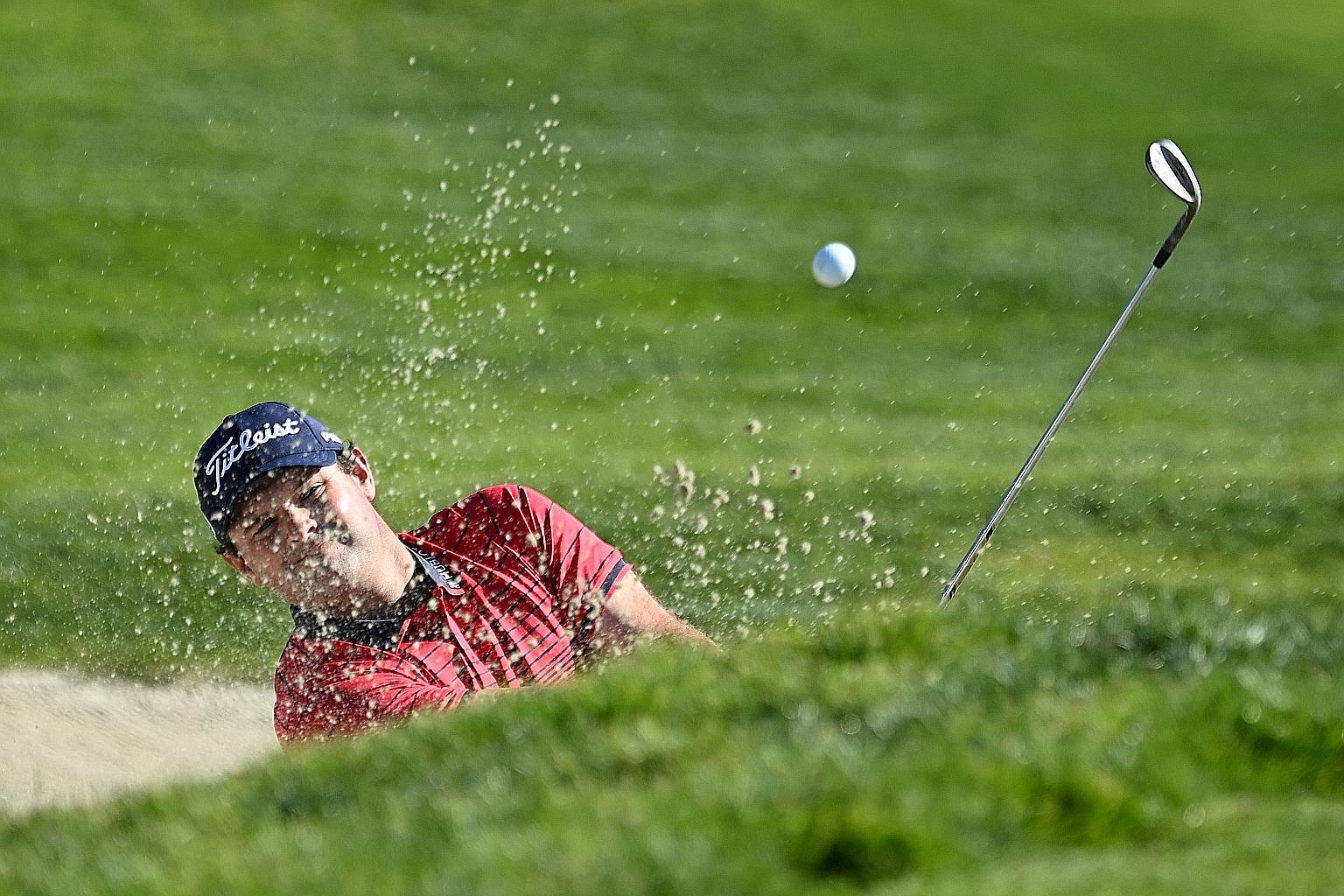 Patrick Reed hitting out of a bunker on the first hole in the final round of the Farmers Insurance Open in San Diego on Sunday. His five-stroke win was marred by accusations that he cheated in the third round but he insists that he played by the book