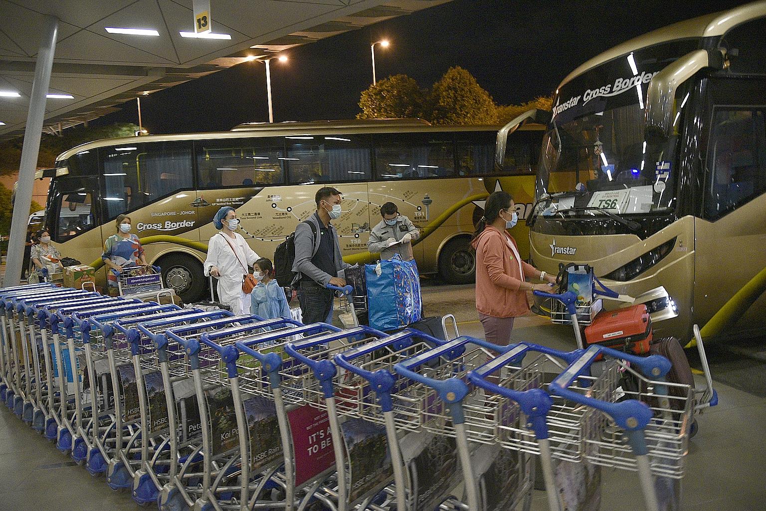 Passengers arriving at Changi T3 last May walking to coaches that took them to designated hotels to serve SHN. Flexible arrangements are in place allowing for these facilities to be activated or stood down depending on demand, said National Developme