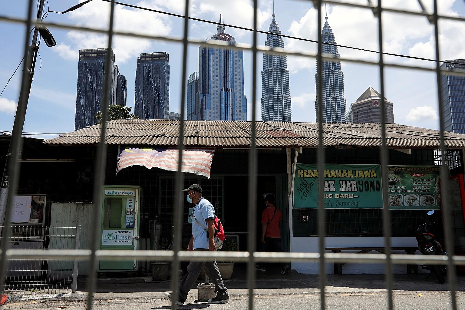 Kuala Lumpur under lockdown yesterday. Malaysia is extending its near-nationwide Movement Control Order by two weeks after the Health Ministry confirmed that all states under the MCO are showing a trend of rising Covid-19 cases. The country yesterday