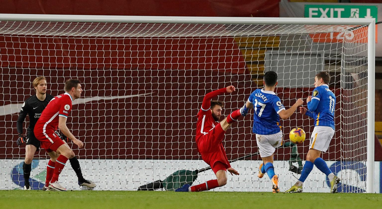Brighton midfielder Steven Alzate flicking the ball past Liverpool defender Nathaniel Phillips just inside the post for the winner at Anfield on Wednesday.
