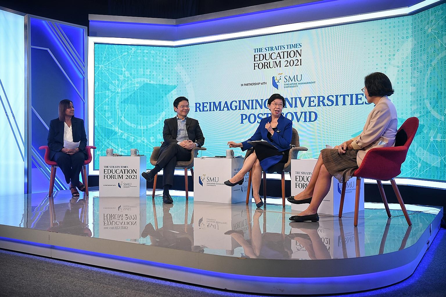 Education Minister Lawrence Wong speaking at The Straits Times Education Forum 2021 on Reimagining Universities, Post-Covid, yesterday. With him are (from left) ST senior education correspondent Sandra Davie, Singapore Management University president