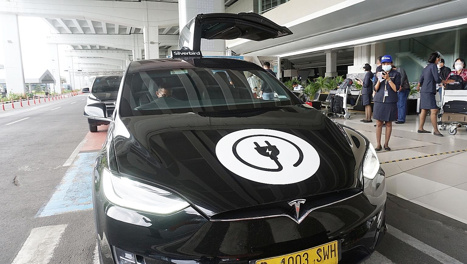 A Tesla model X airport taxi outside Jakarta's Soekarno-Hatta International Airport last December. The US electric car company plans to invest in factories in Indonesia to make electric vehicle lithium batteries and power generators. PHOTO: AGENCE FR