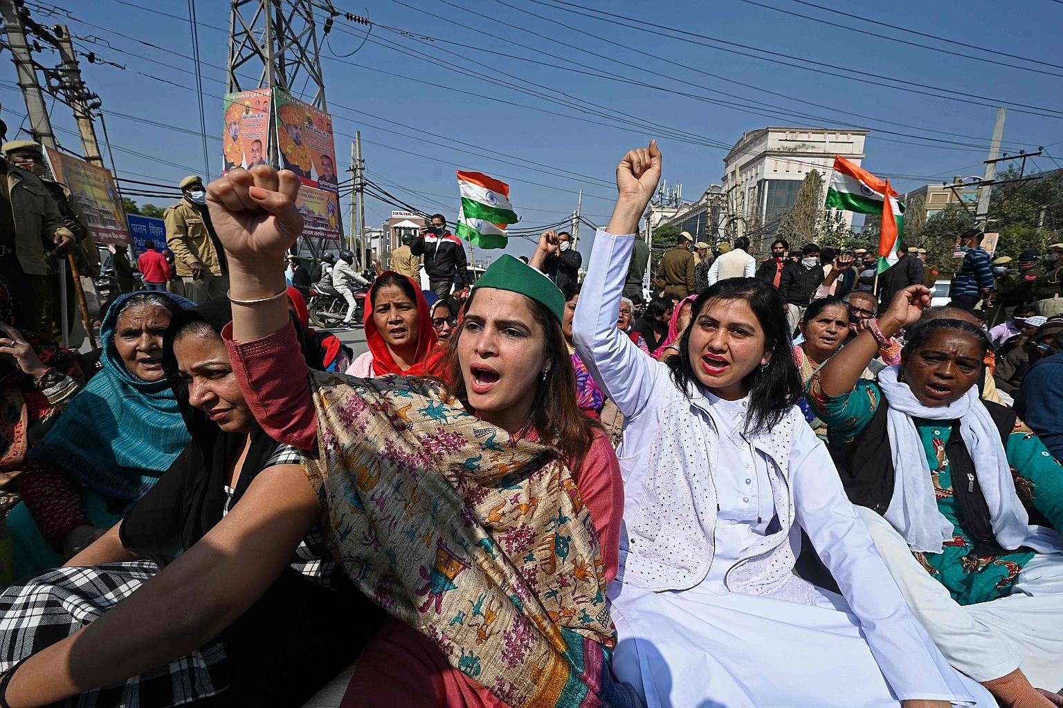 A roadblock protest called by farmers in Gurgaon, India, yesterday, as part of ongoing demonstrations against the central government's recent agricultural reforms. Backed by a growing international campaign of celebrities and activists, farmers on Fr