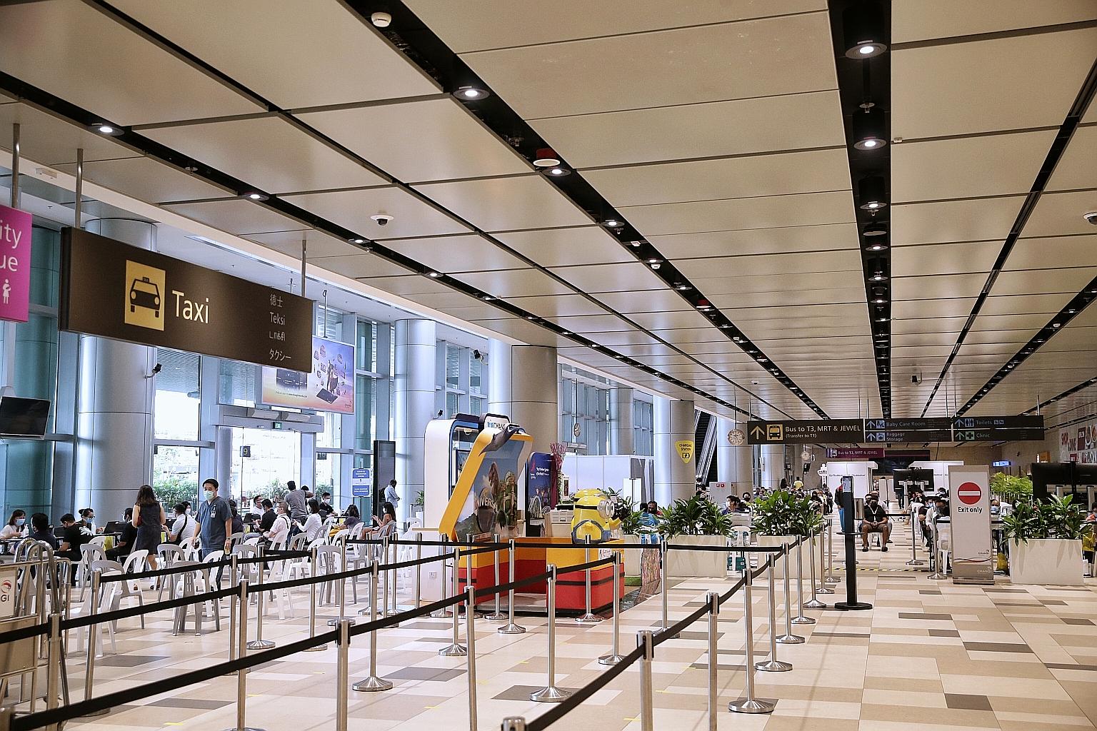 Worst-case scenarios for international travel could be averted, however, with new cases reportedly falling globally as more countries ramp up their vaccination programmes, said a public health expert. ST PHOTO: KEVIN LIM