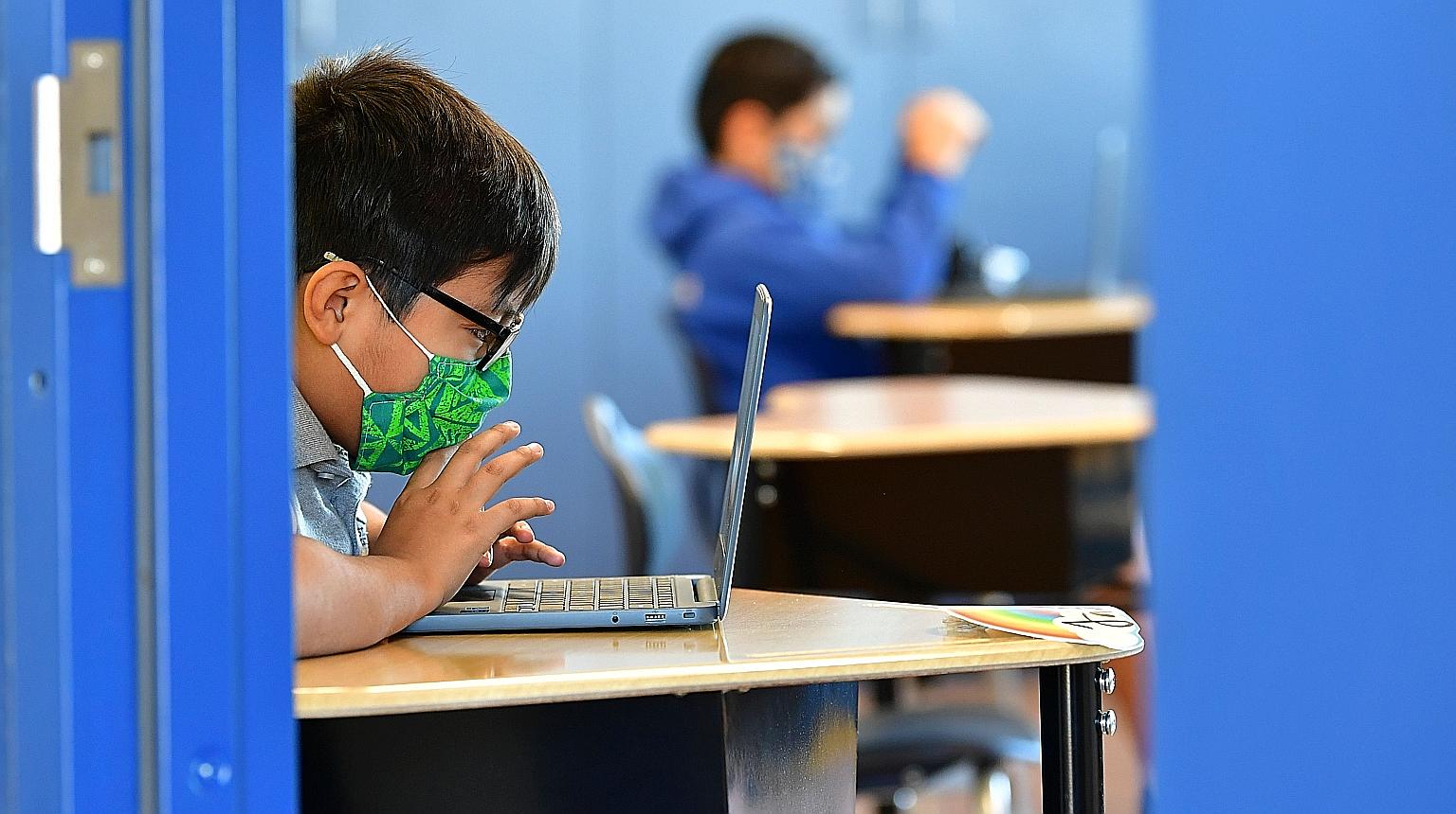 A quarter of Singapore parents surveyed said their children experienced cyber bullying last year, up from 16 per cent in 2019. PHOTO: AGENCE FRANCE-PRESSE