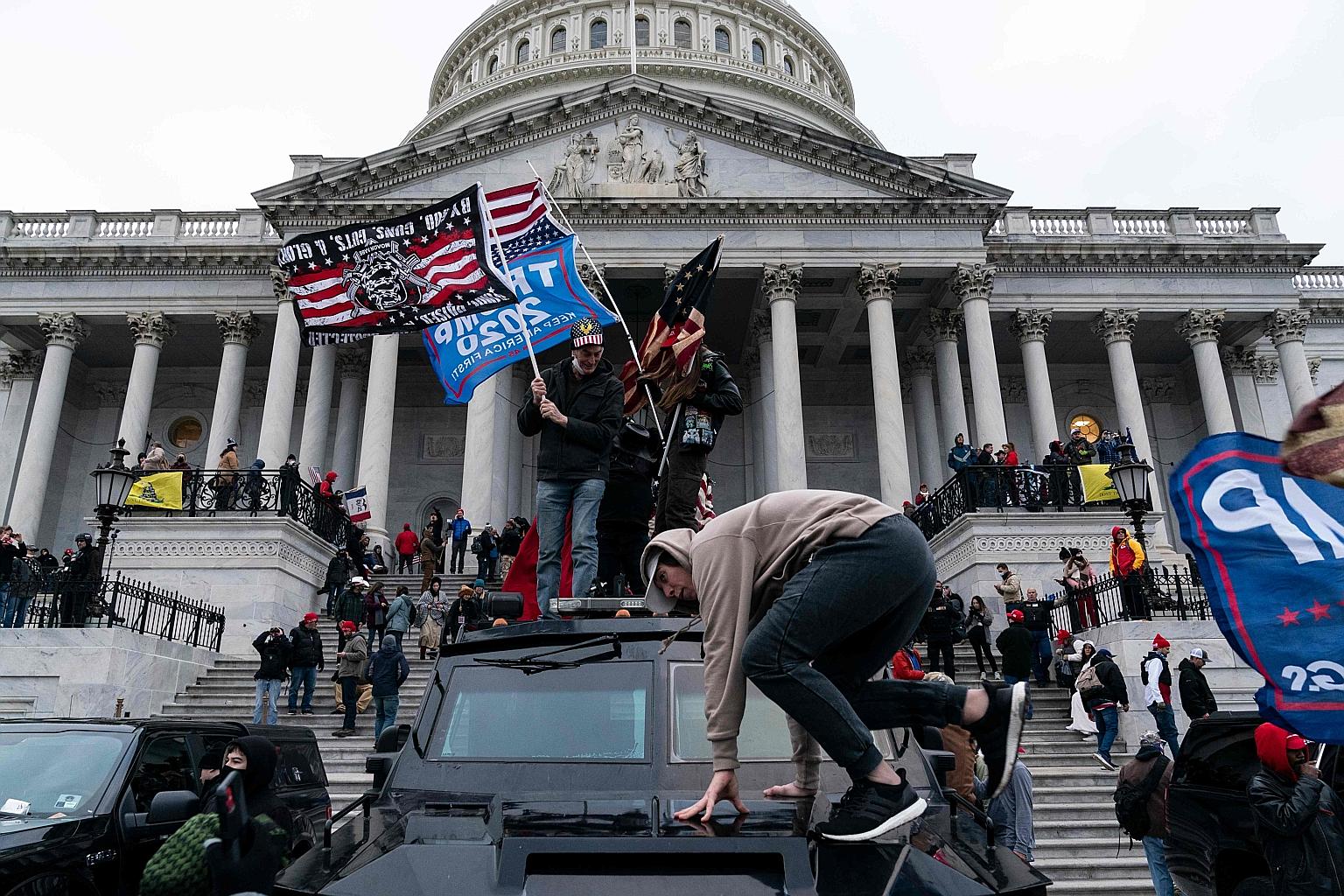 Protesters outside the US Capitol in Washington on Jan 6. Twitter banned then US President Donald Trump from its platform soon after. Mr Trump's critics hailed the move but there was also a vocal outcry from politicians, activists and civil society a