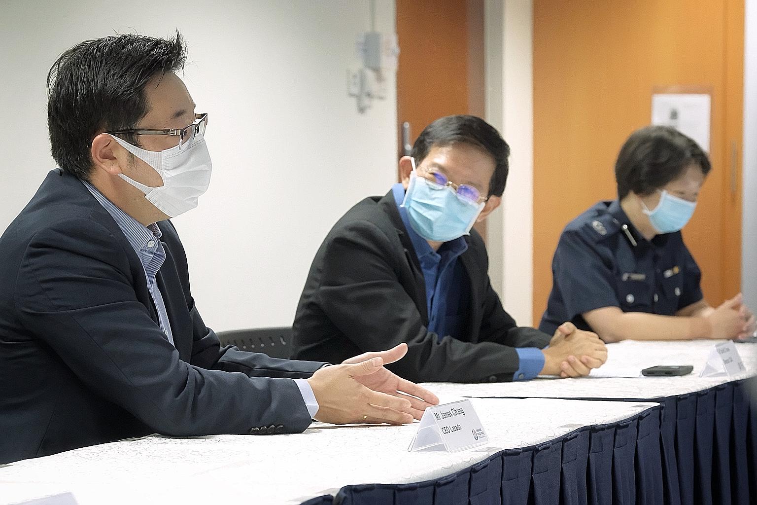From left: Lazada Singapore chief executive James Chang; Commercial Affairs Department (CAD) director David Chew; and CAD Specialised Commercial Crime Division assistant director Aileen Yap speaking to the media on Monday. ST PHOTO: GAVIN FOO
