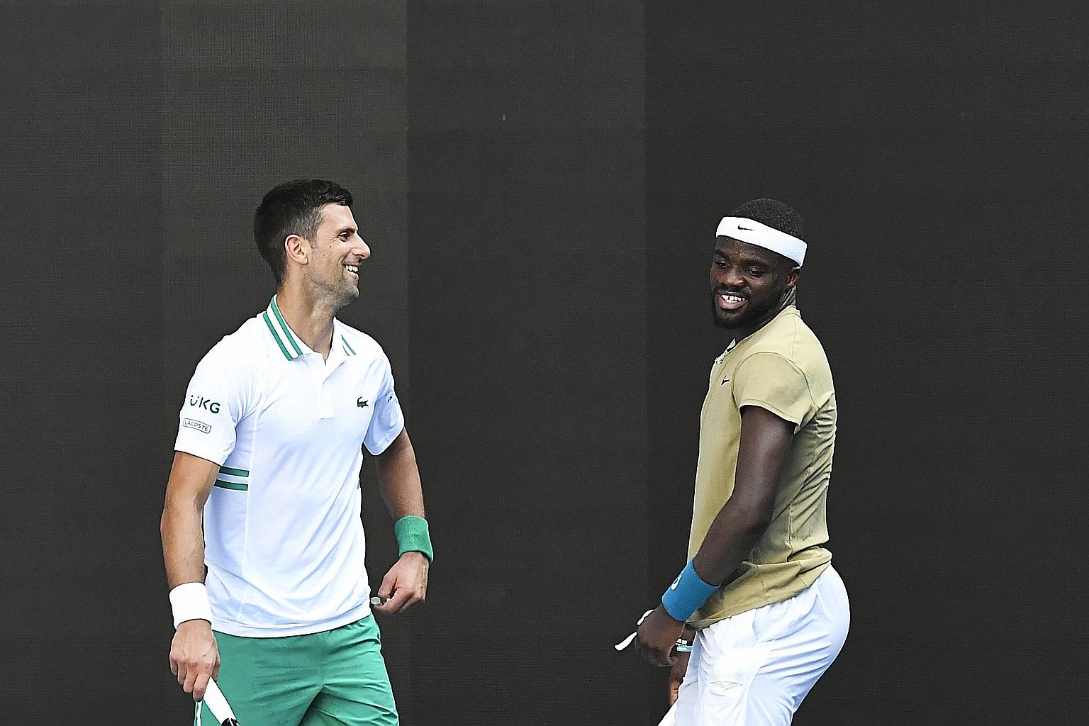 World No. 1 Novak Djokovic of Serbia (left) took four sets to beat American Frances Tiafoe in their Australian Open second-round match.